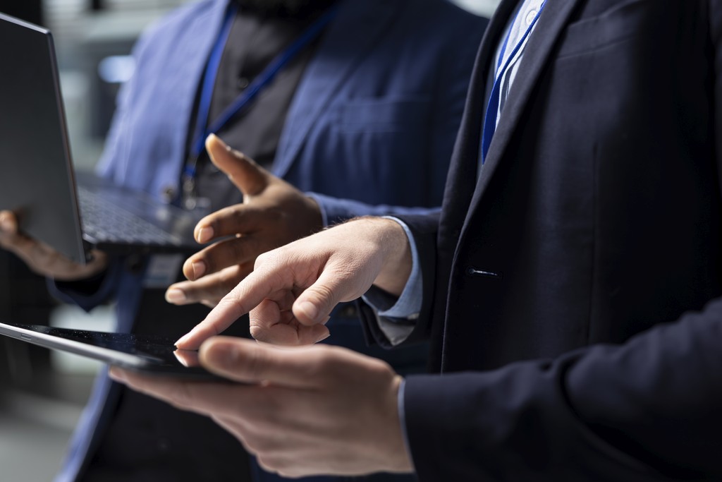 husband and wife working happily on a laptop