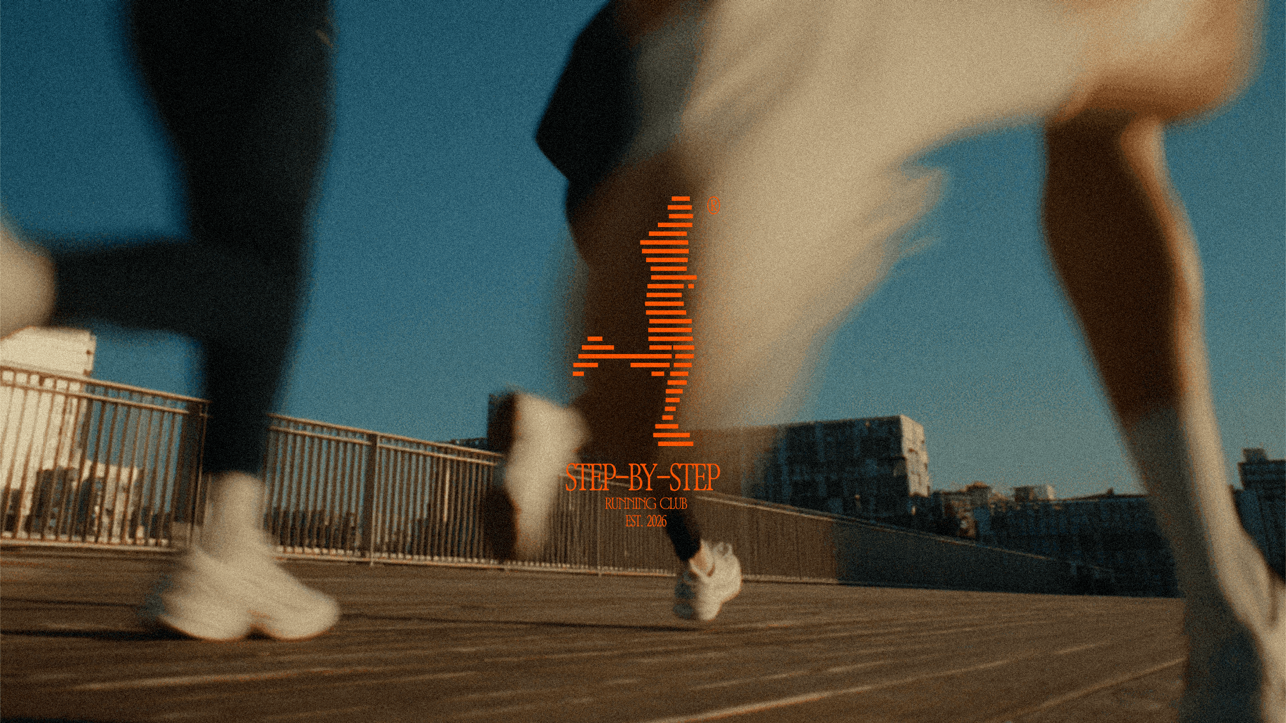 A grainy photo of people running with the logo for the Step-by-step Running Club brand in the middle of the image in bright orange.