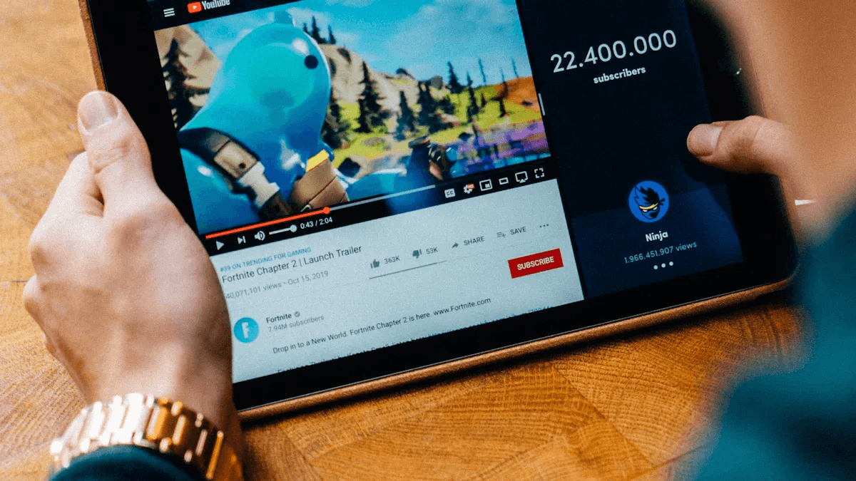 Person holding a tablet - Best YouTube Video Summarizer