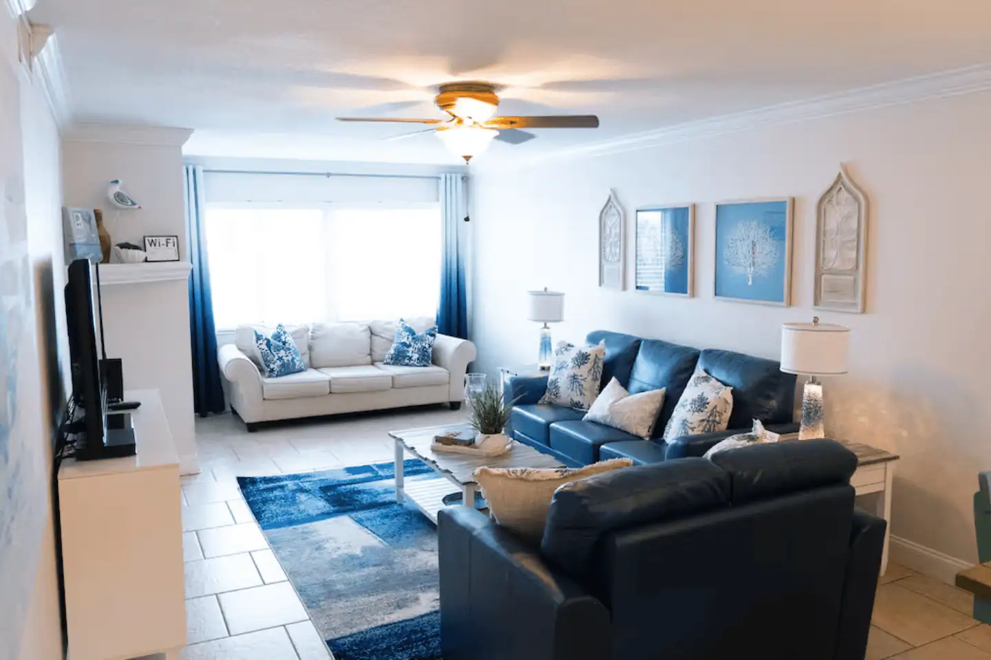 Living room of a beachside Treasure Island condo with coastal furnishings and bright natural light