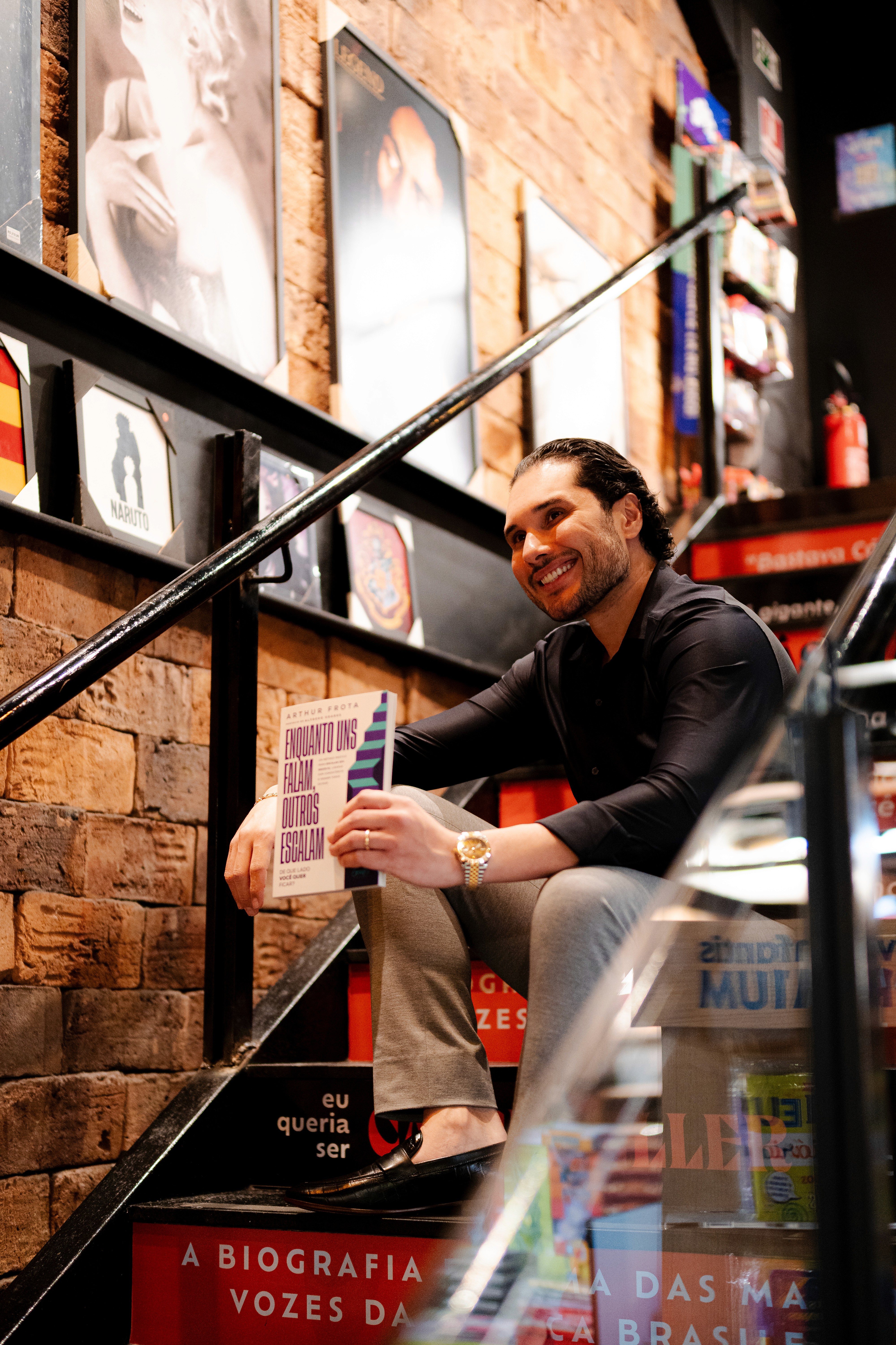 Man in VR headset interacts with green holographic code displayed on a curved screen.