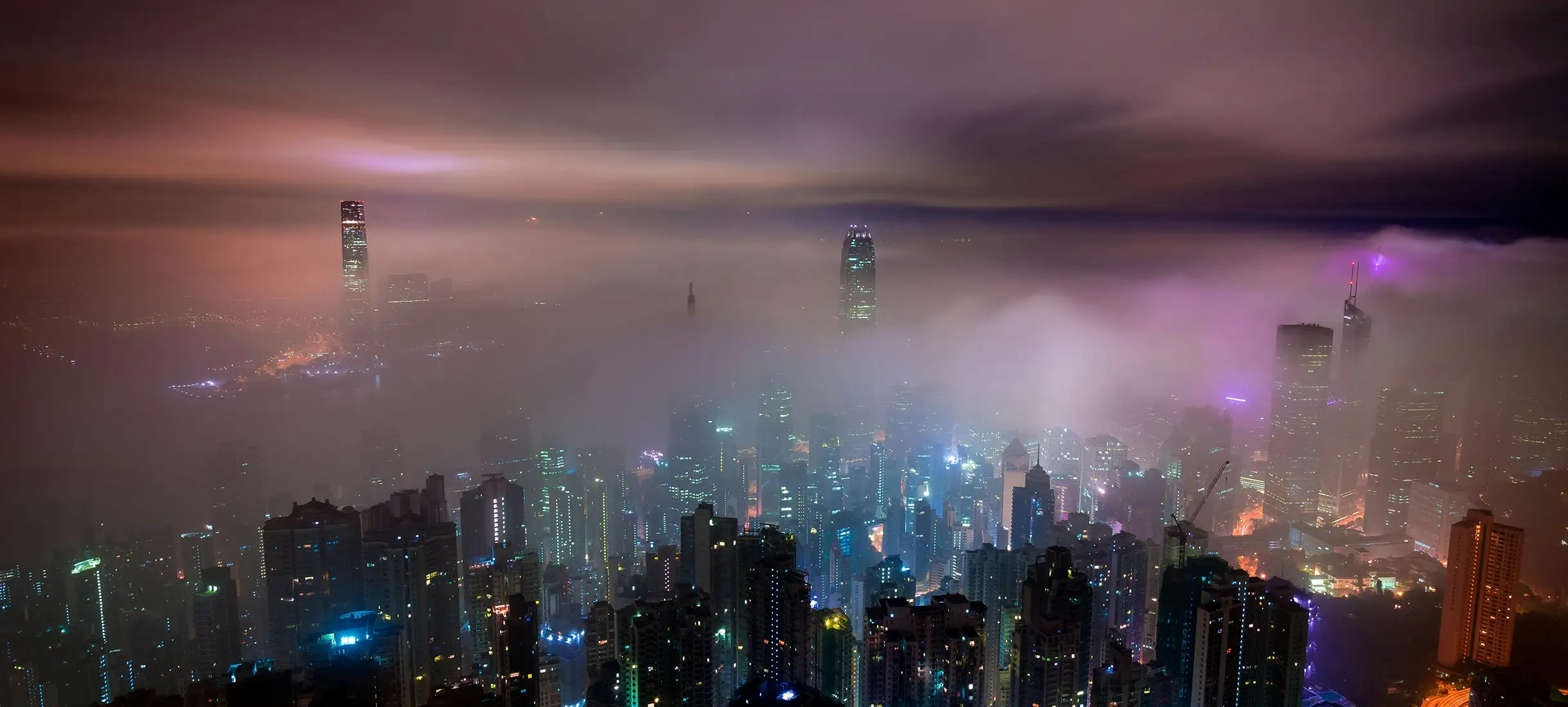 Dubai city skyline at night with modern architecture and waterfront