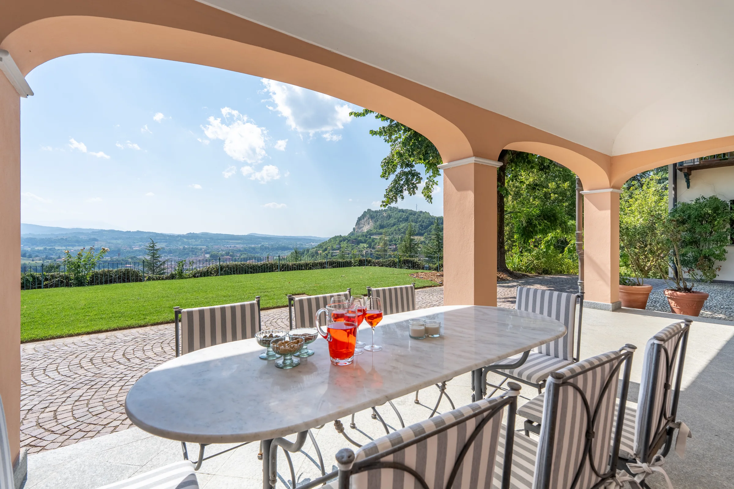 Arched terrace overlooking the countryside — Villa Ceva, Italy. Photography by Yunes Calore.