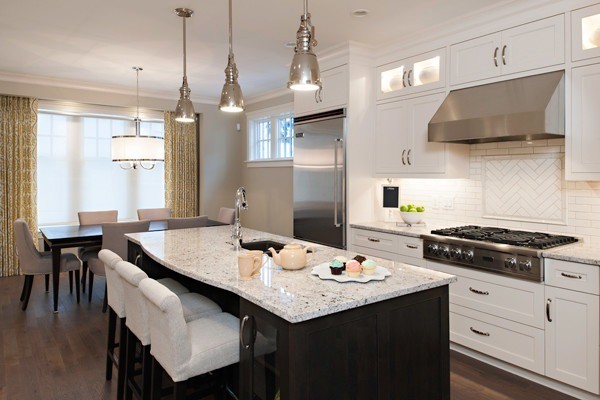 Image of Luxury kitchen with island seating, stainless steel appliances, and elegant design by KHD Homes experts.