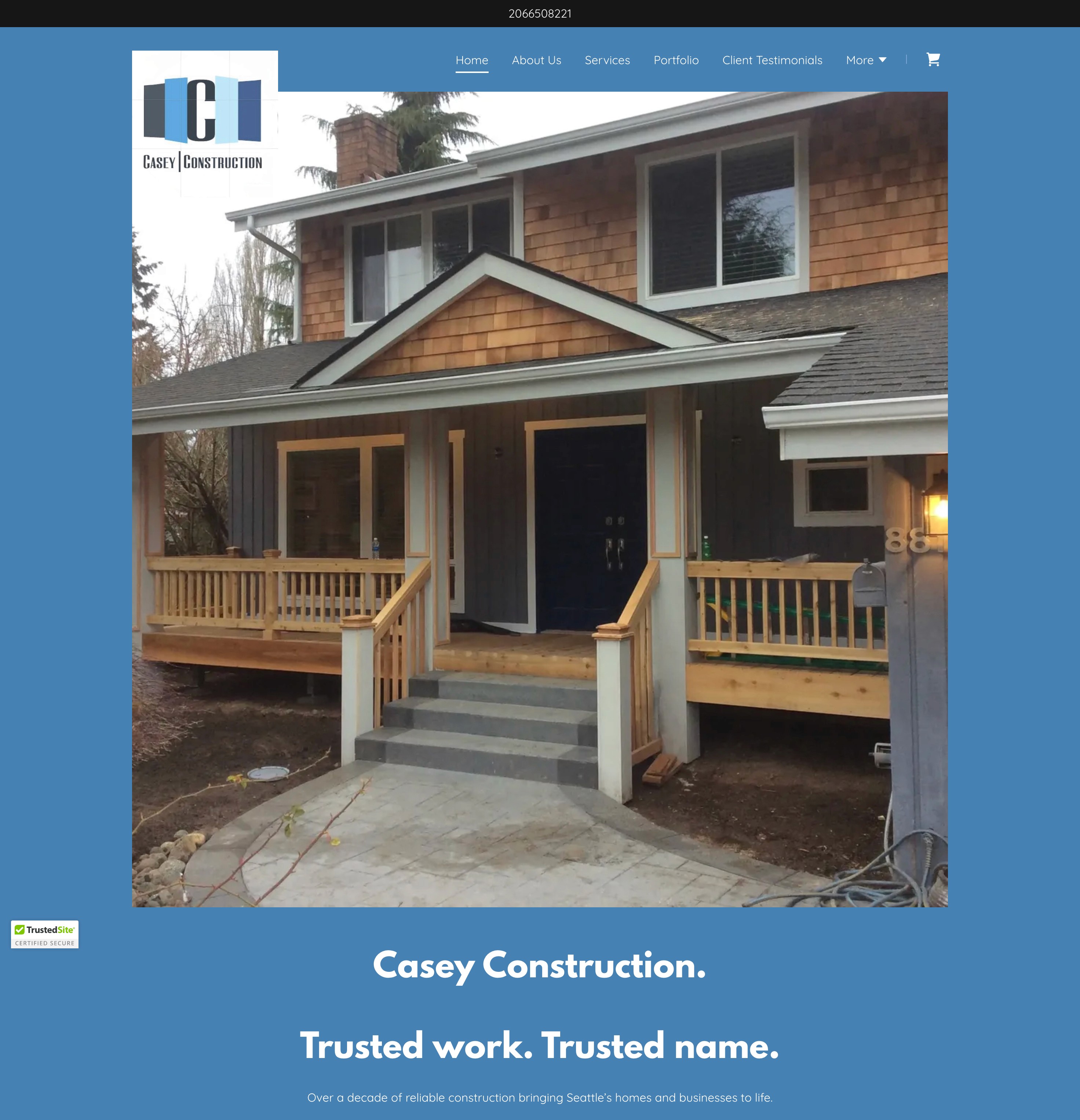 Desktop screenshot of the original Casey Construction website showing a photo of a residential home with a wooden porch and a blue footer containing the company slogan.