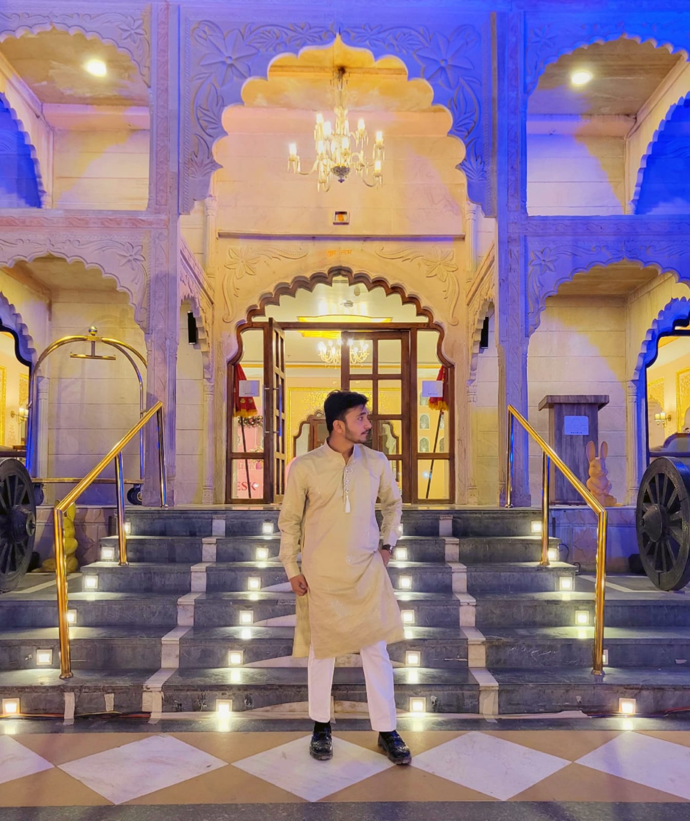 Adnan framed by the architecture of a wedding venue