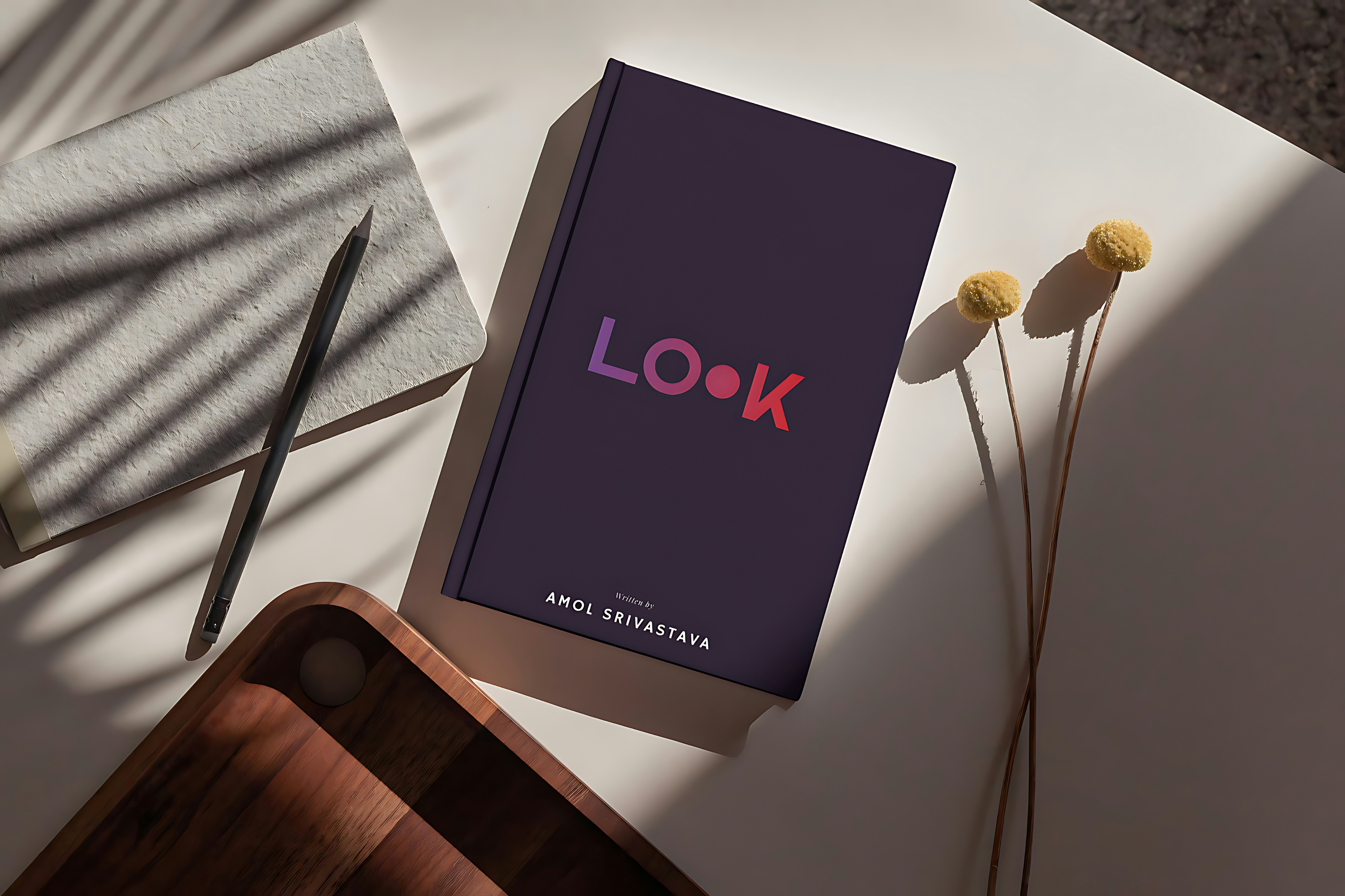 A book with the word "look" on a table.
