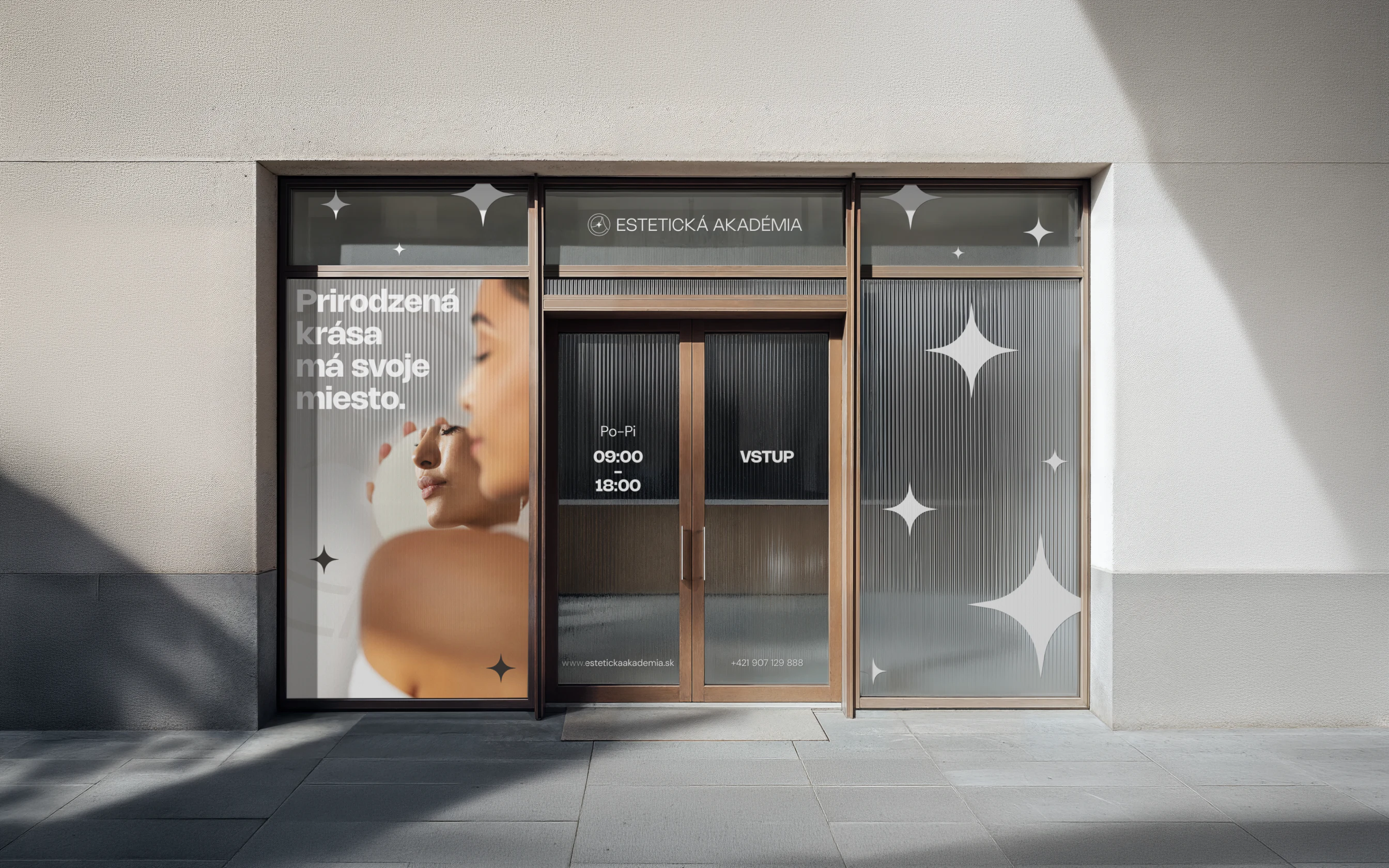 Estetická Akadémia clinic storefront window branding.