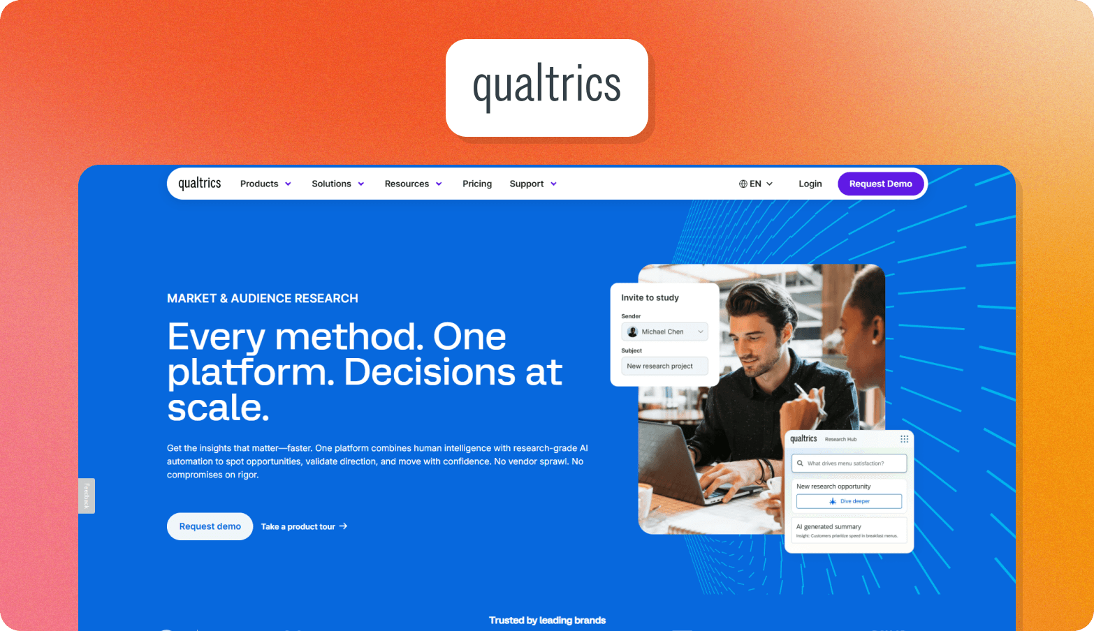 Screenshot of the Qualtrics Market & Audience Research homepage, headlined "Every method. One platform. Decisions at scale." on a bold blue background. The page describes Qualtrics as combining human intelligence with research-grade AI automation to spot opportunities, validate direction, and move with confidence. A product UI preview shows an "Invite to study" panel, a Research Hub interface with the query "What drives menu satisfaction?", and an AI-generated summary insight. A photo of two people collaborating on a laptop is shown alongside the UI. A "Trusted by leading brands" label is visible at the bottom. The Qualtrics wordmark logo appears above the browser screenshot on an orange gradient background.