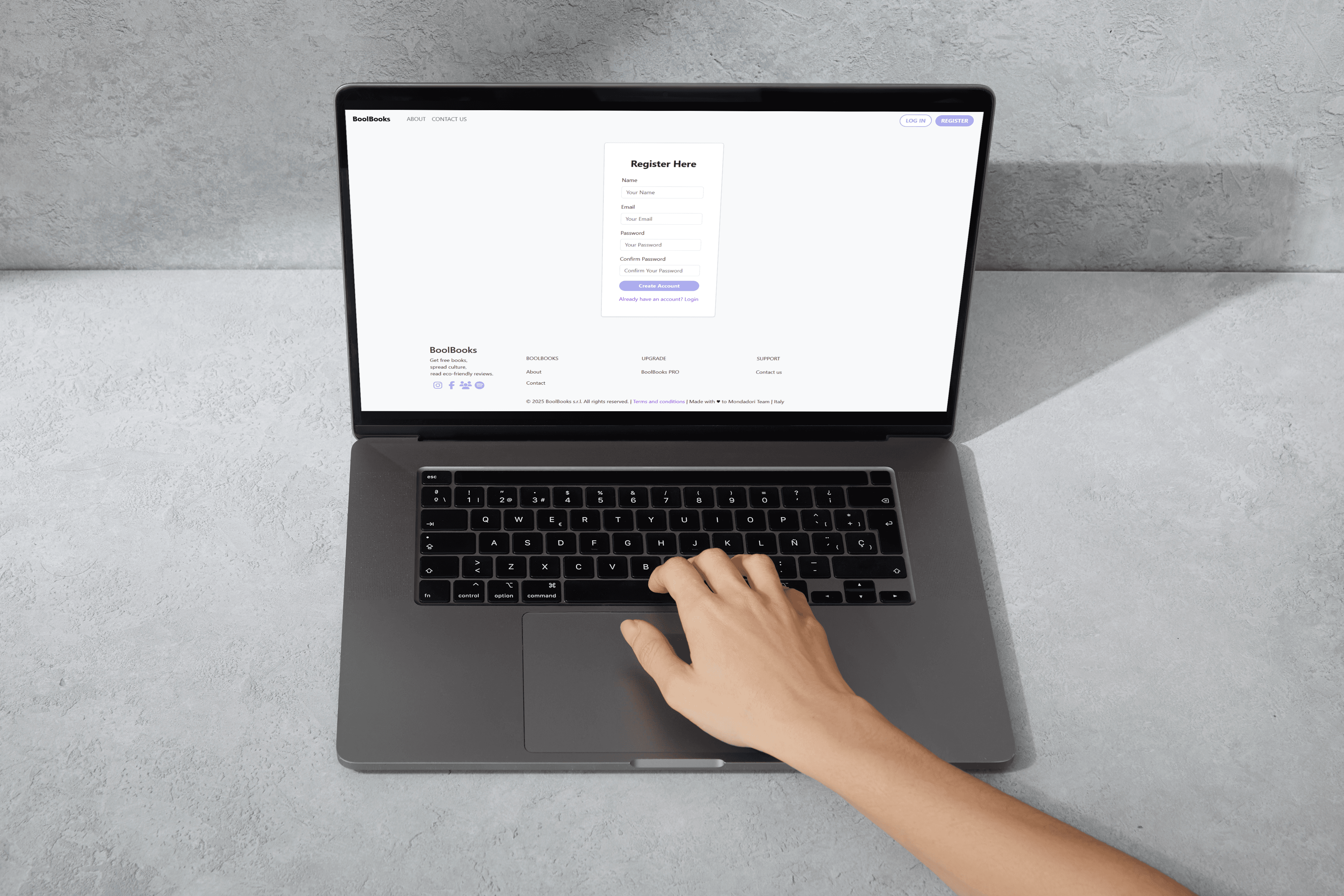 A mockup of a Macbook for the about us page of the hair salon website
