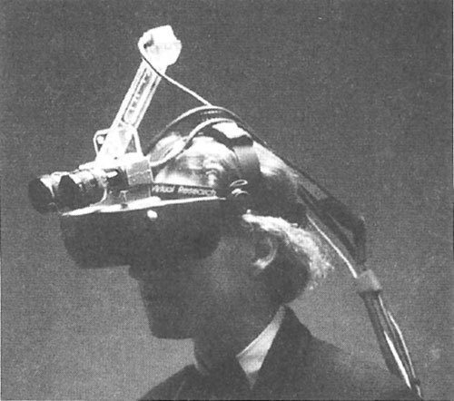 Black and white image of people working at a table with laptops, showing hands gesturing during discussion of digital content displayed on screens, with fabrica® logo in the corner.