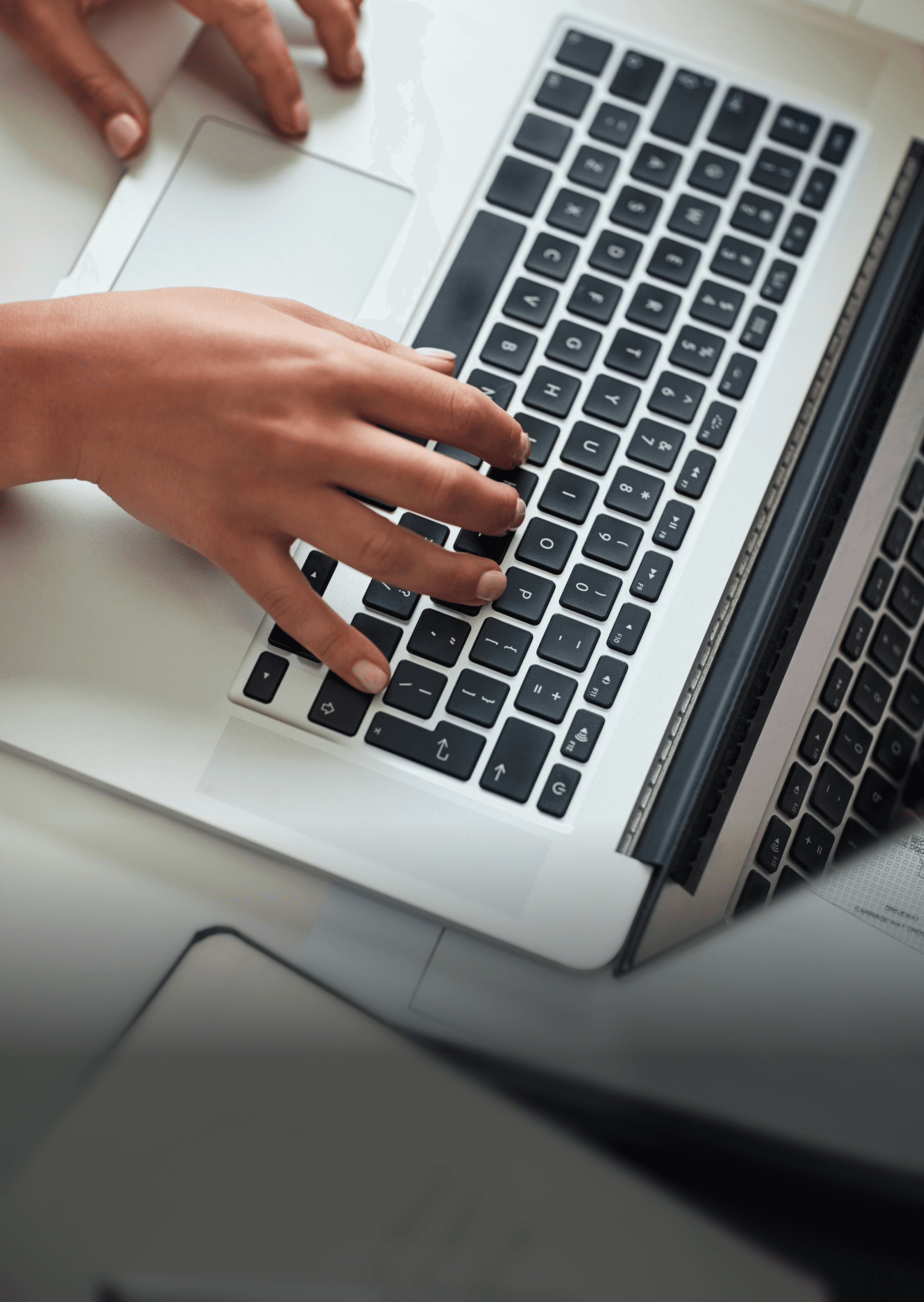 photo of someone typing on a keyboard
