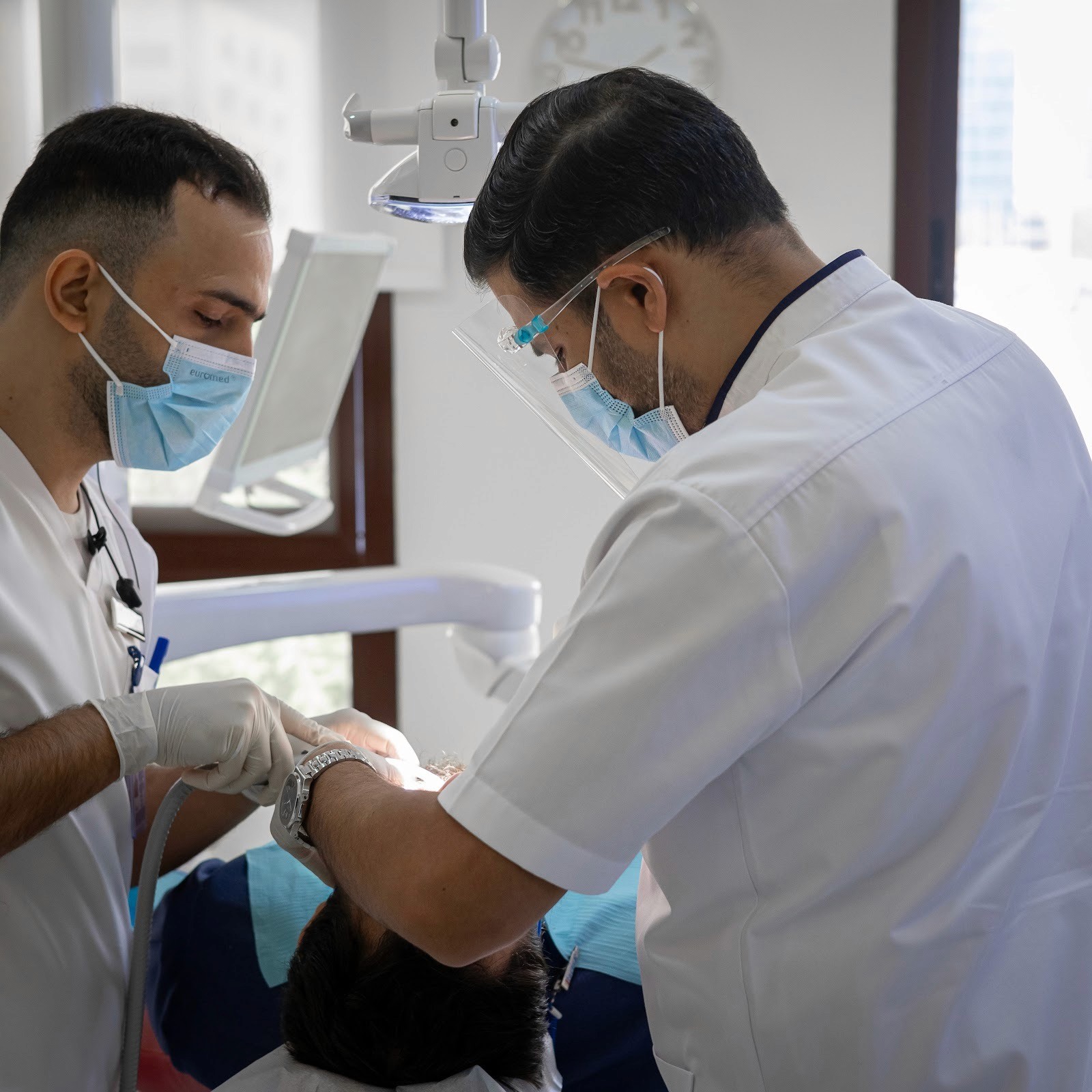 Doctor performing a Hollywood Smile procedure with an assistant at Bella Medical Center.