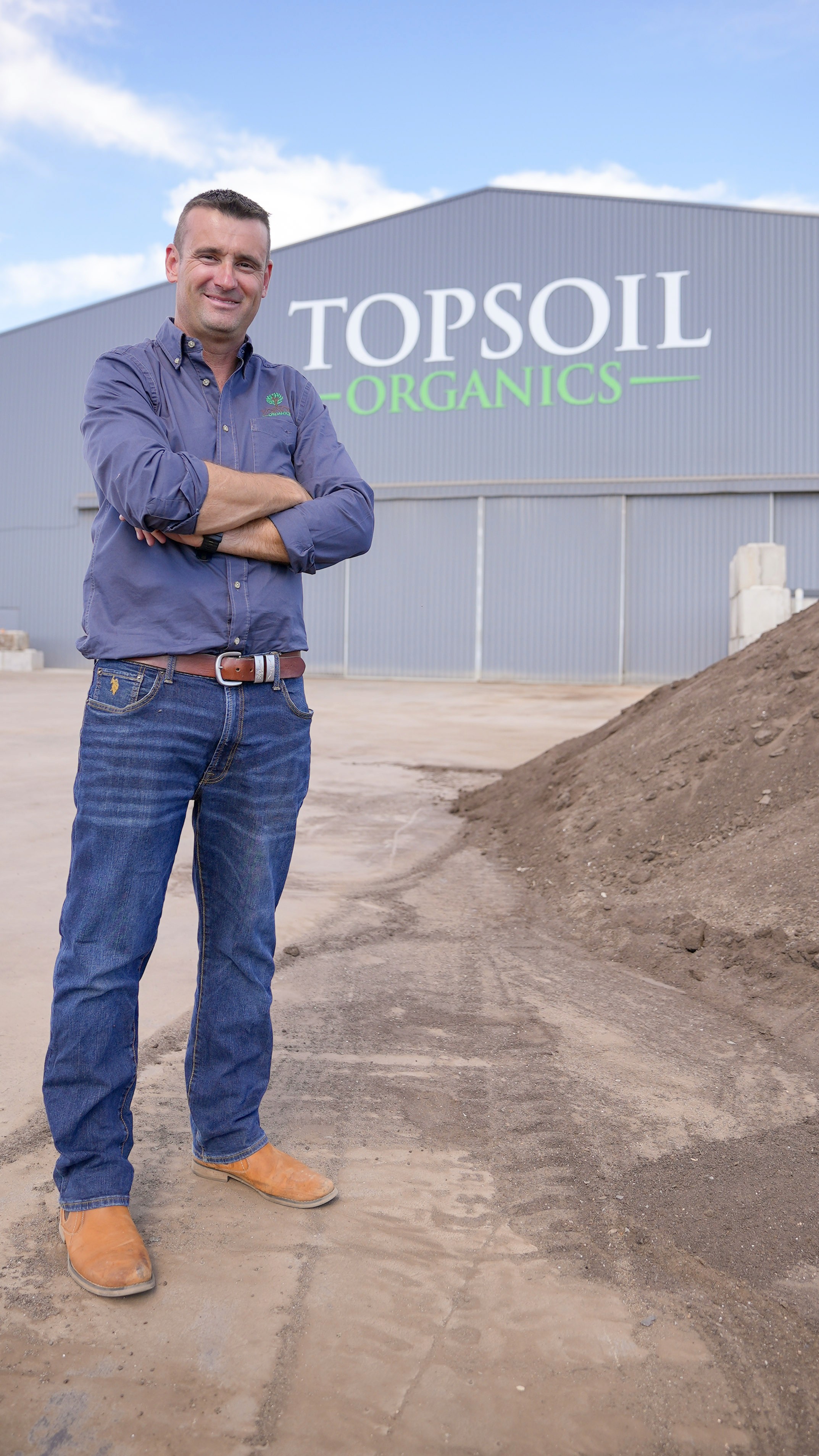 Dan Nicholson standing outside Topsoil Organcs facility in Forbes