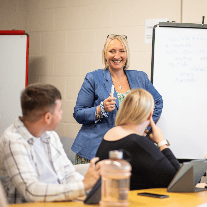 Nimble Medias female cheif officer hosting a team meeting for two people.