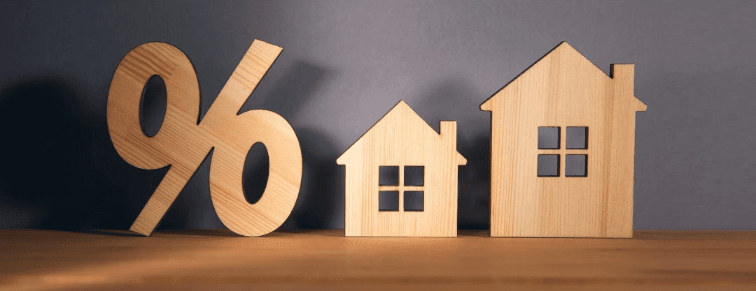 Silhouette of Percentage and house sign symbol icon wooden on wood table