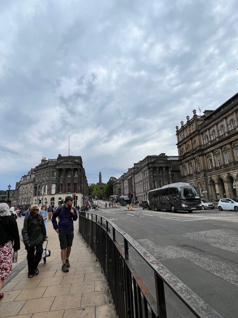 Neoclassical buildings along a broad road and a footpath in Edinburgh