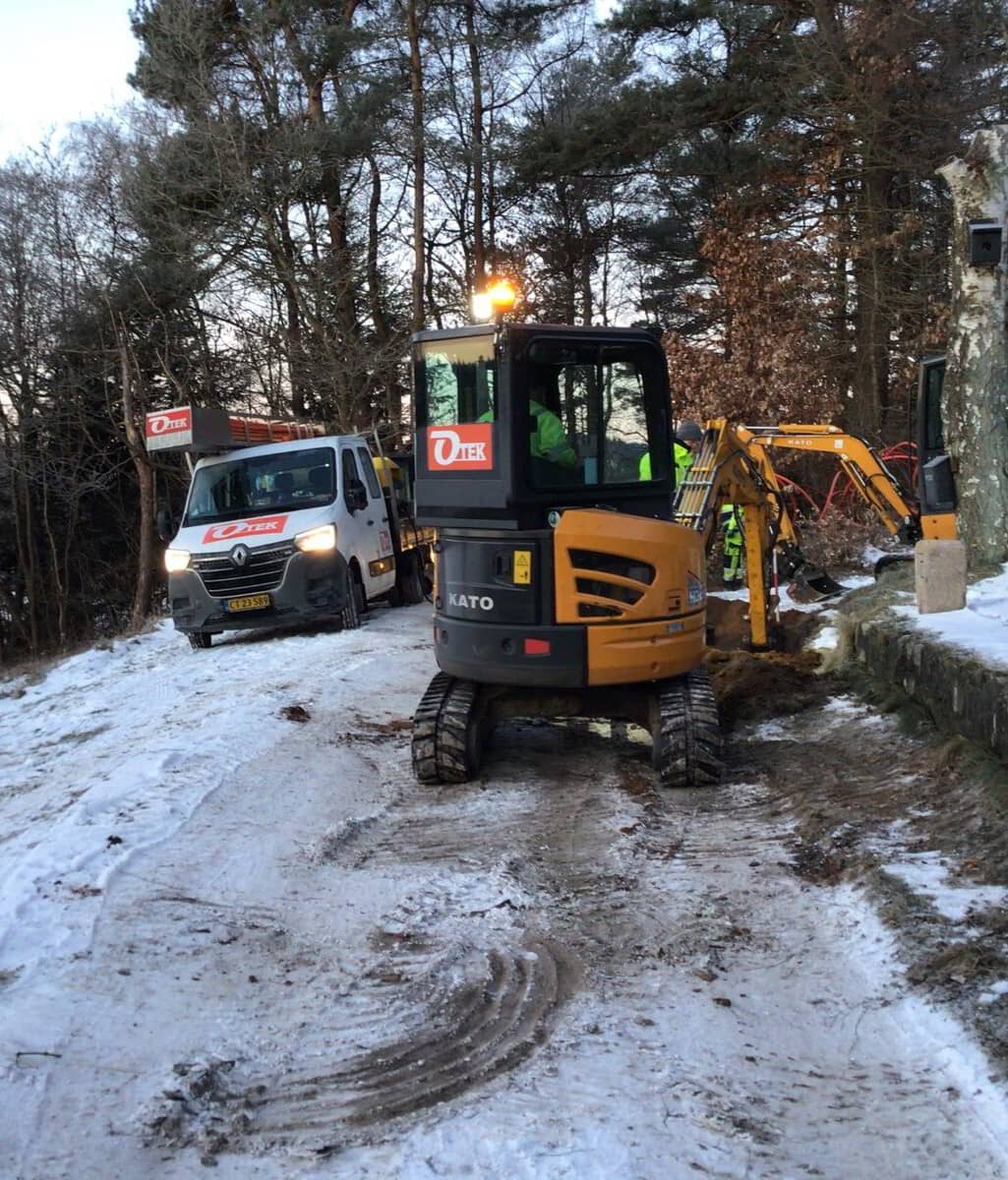 minigraver i sne og frost