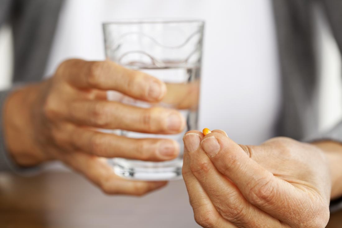 man taking a pill - Can Tirzepatide Cause Blood Clots
