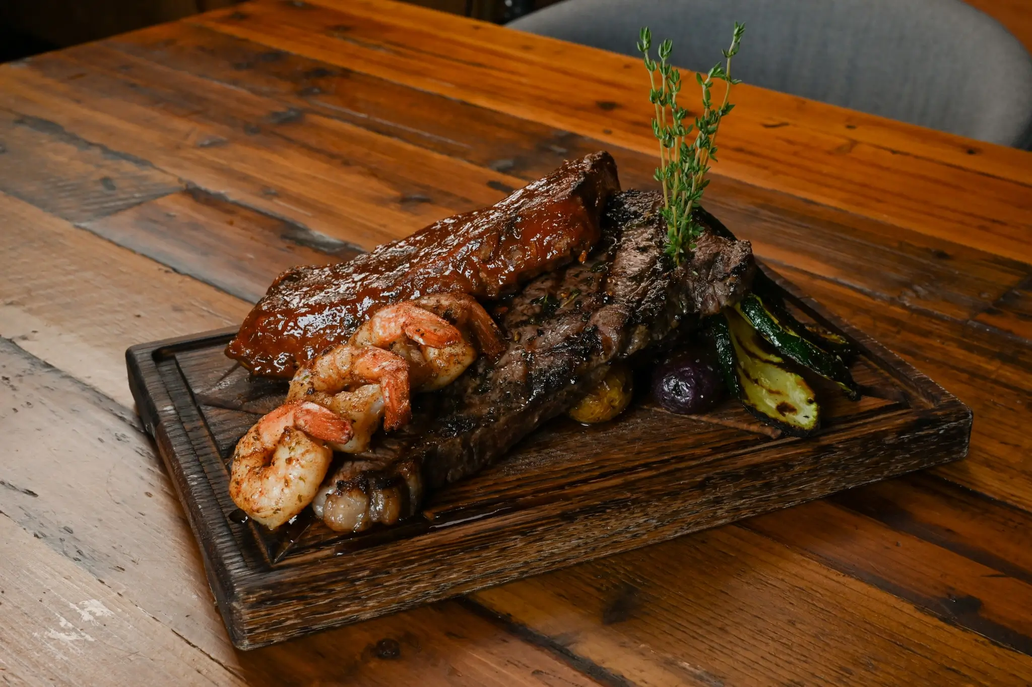 Various meats on a wood plate