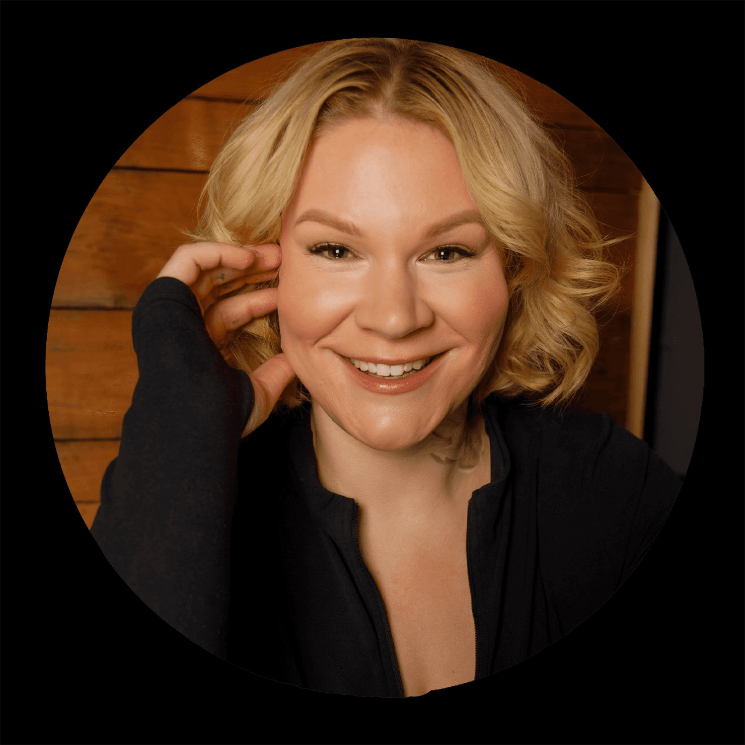 woman in black crew neck t-shirt wearing brown framed eyeglasses standing on rocky shore during