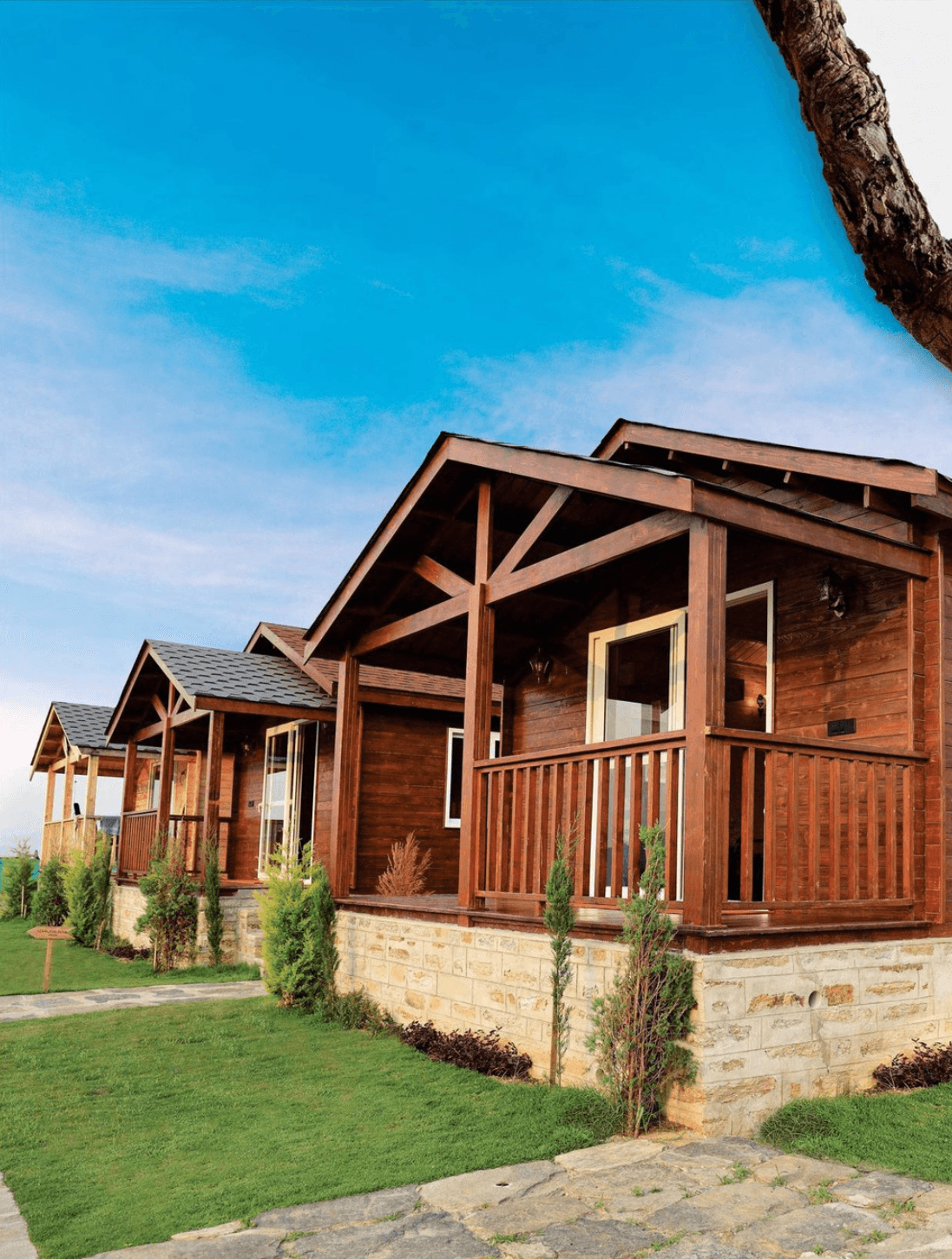 <img src="uttarakhand-chalets.jpg" alt="Swiss-style wooden chalets under a bright blue sky in Uttarakhand, surrounded by mountains.">