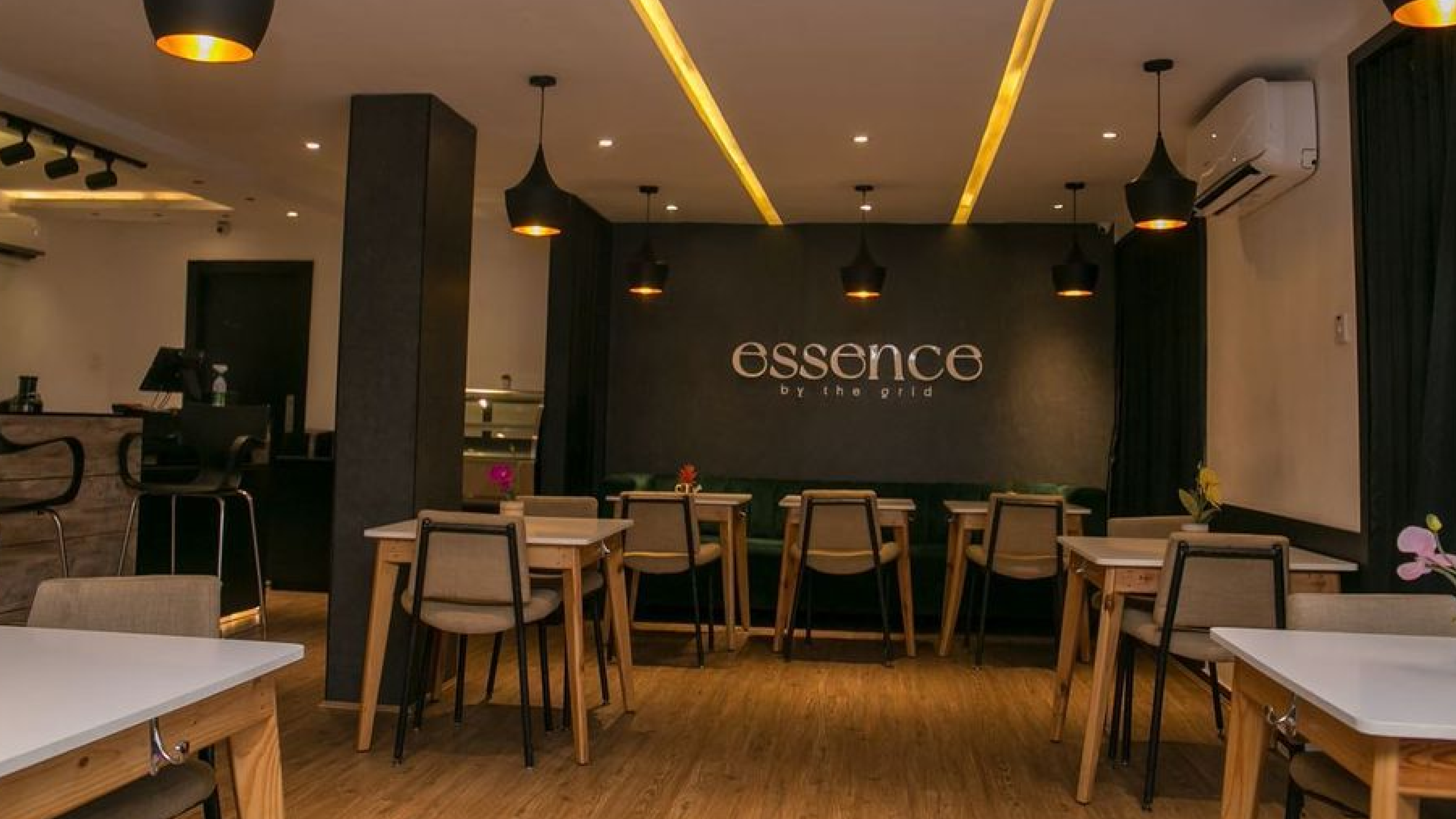 Bright orange drawstring fabric bag tied at the top, printed with a bold black smiley face and the text “Smiley Co” above it against an orange background.