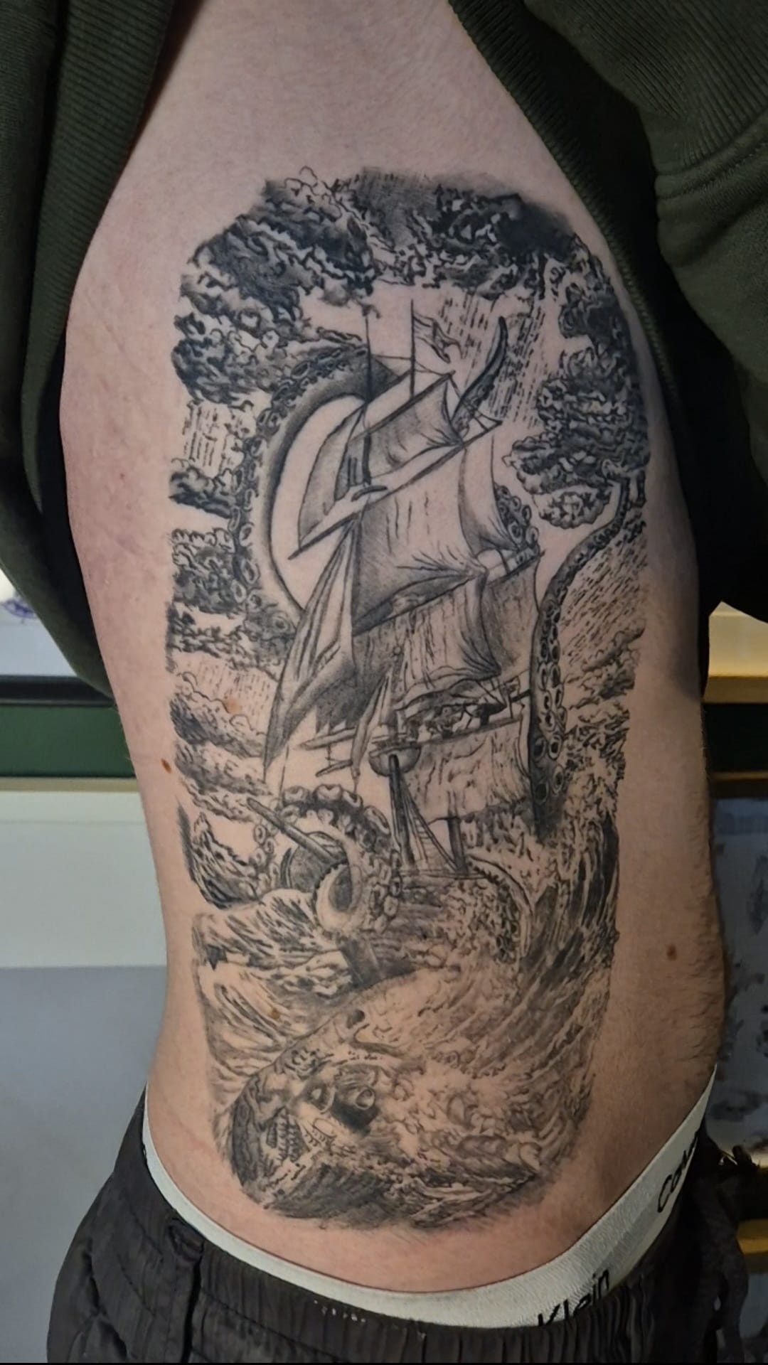 Black and grey mandala tattoo on chest in Hazel Grove