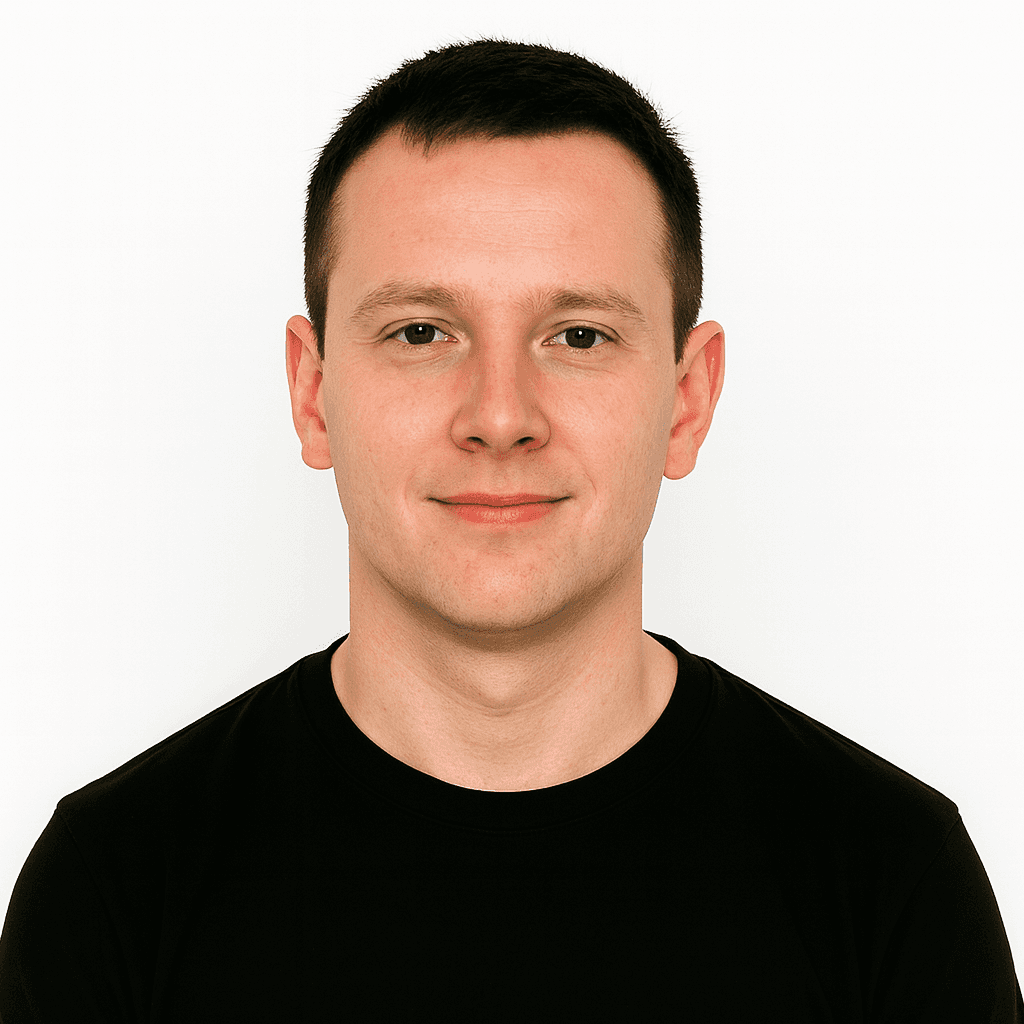 Man with short light brown hair wearing a black crew-neck shirt.