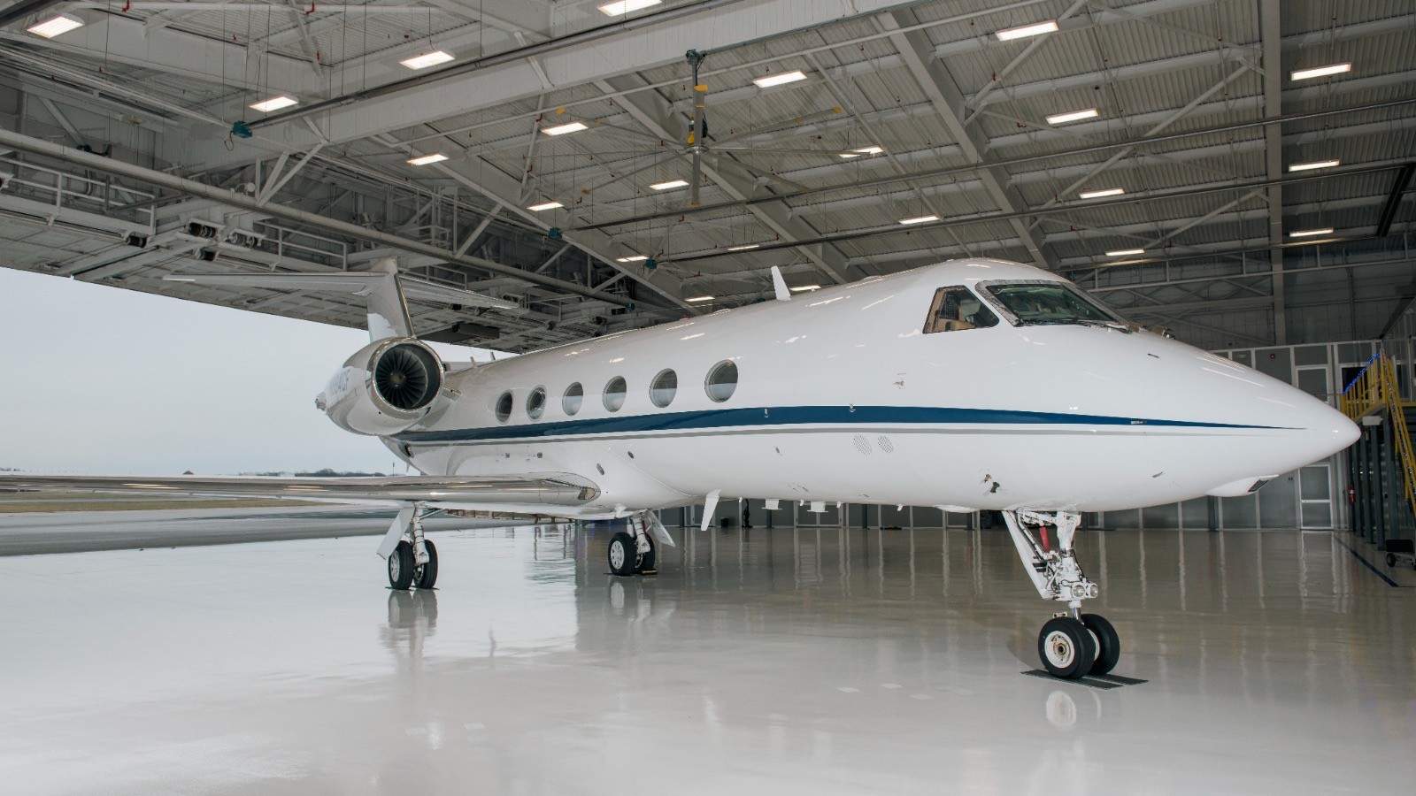 Gulfstream GIV-SP N884CF in the hangar, front three-quarter view