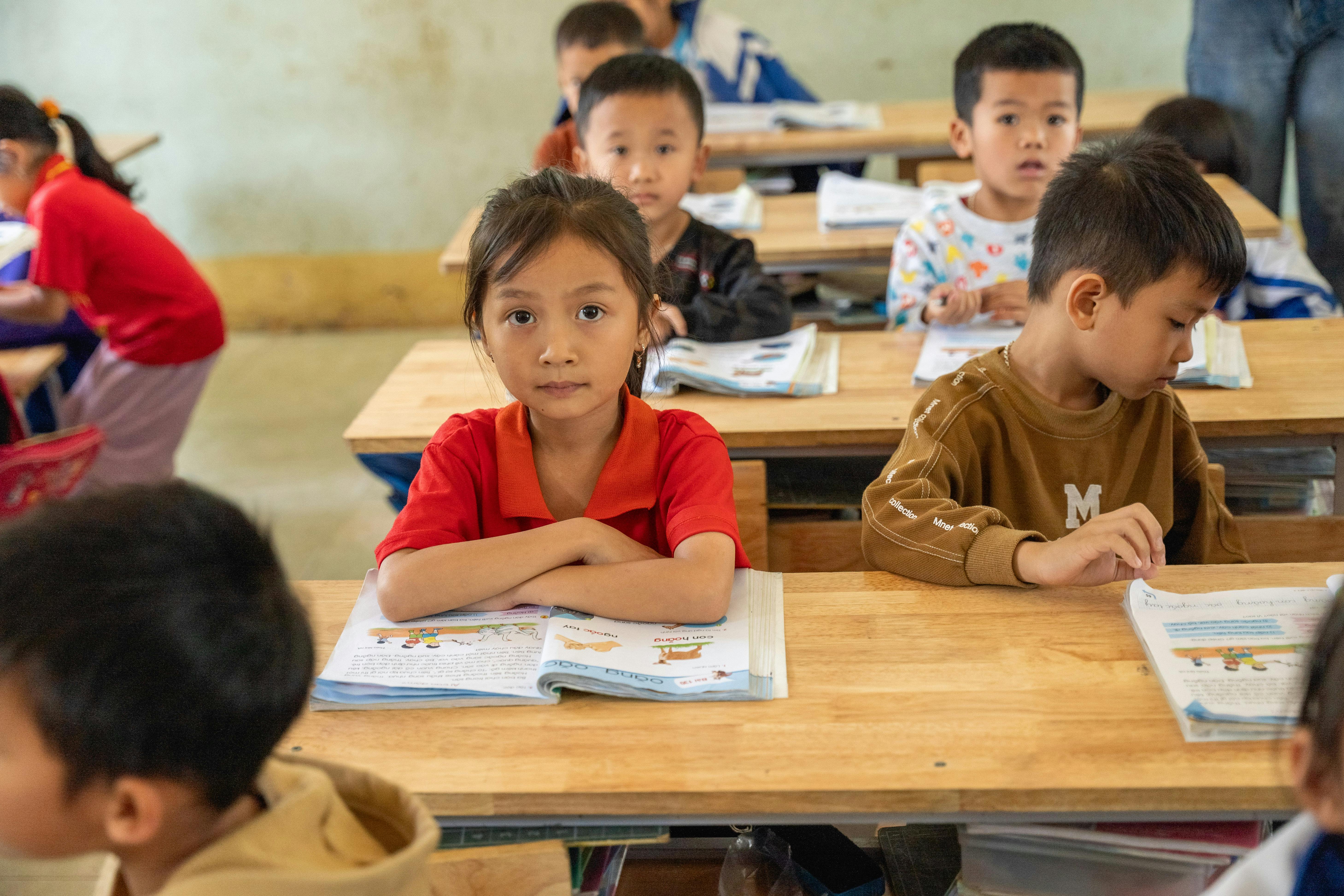 five toddlers near the window