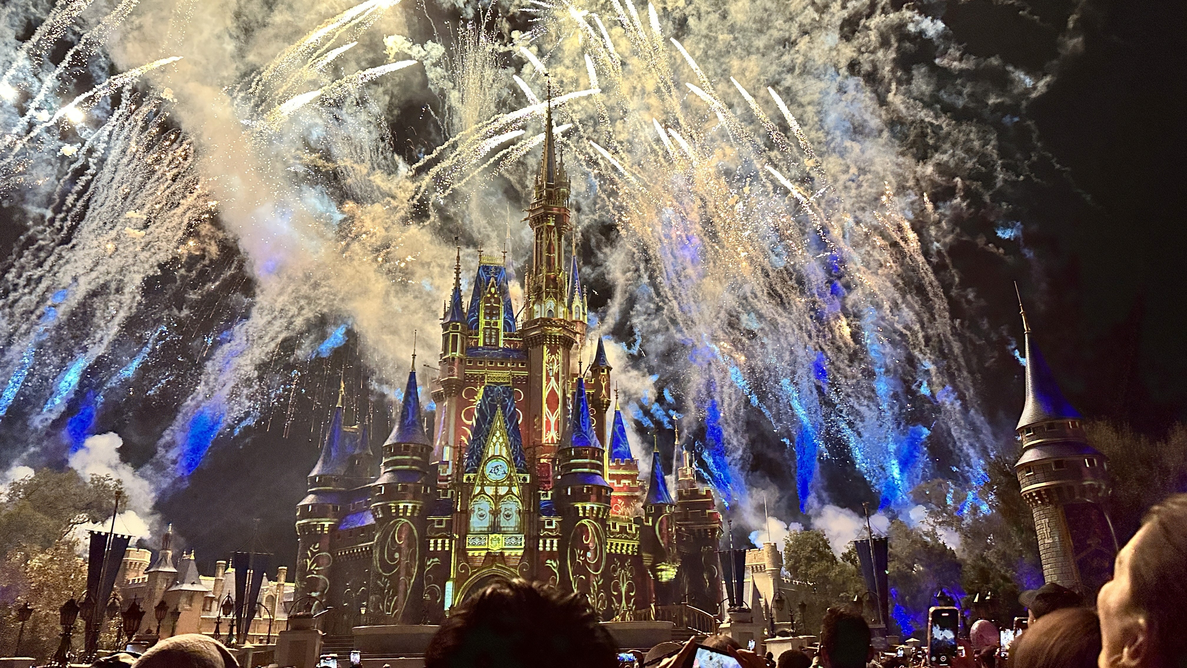 a group of people walking on a sidewalk