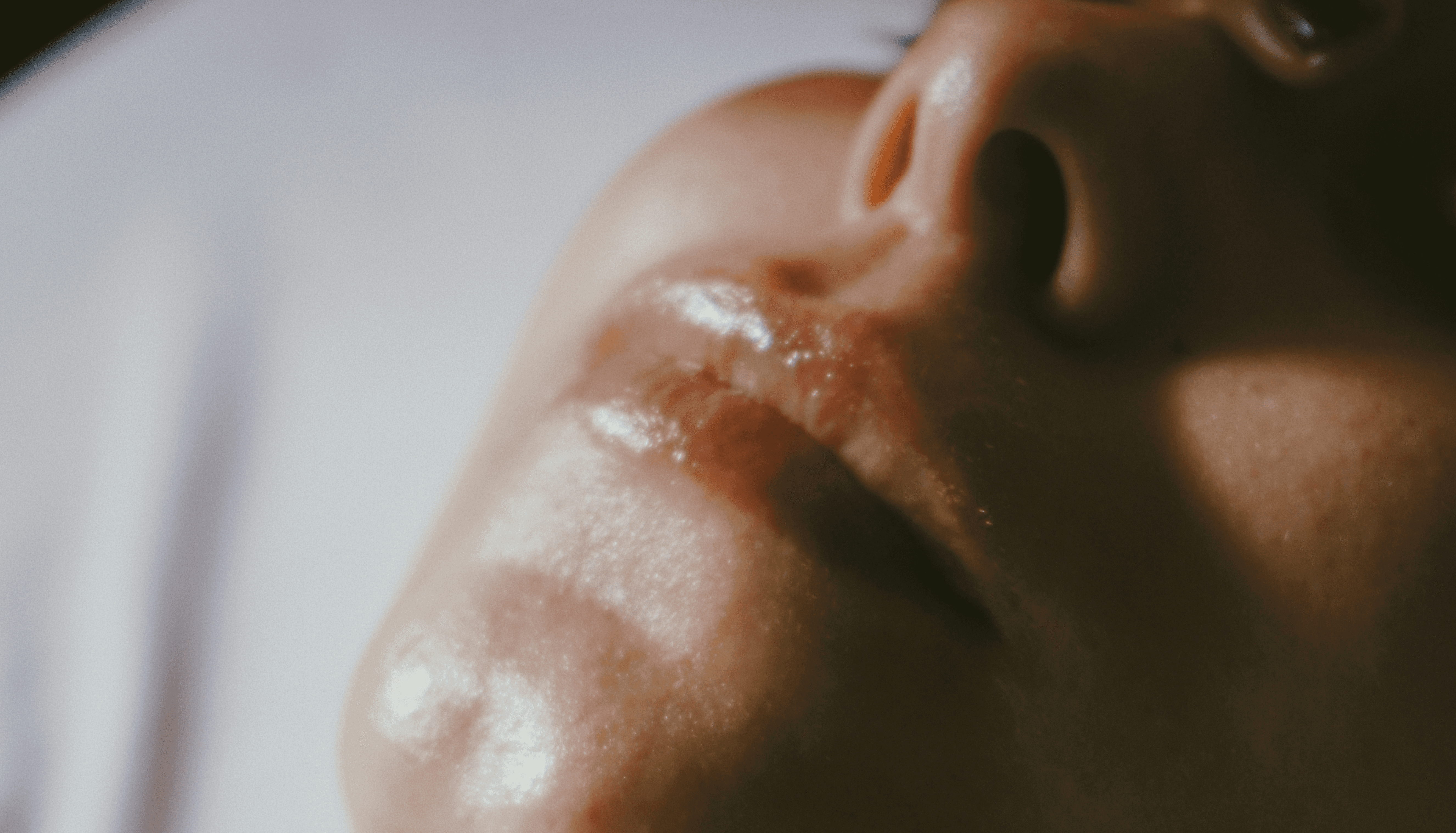a woman getting a facial massage on her face