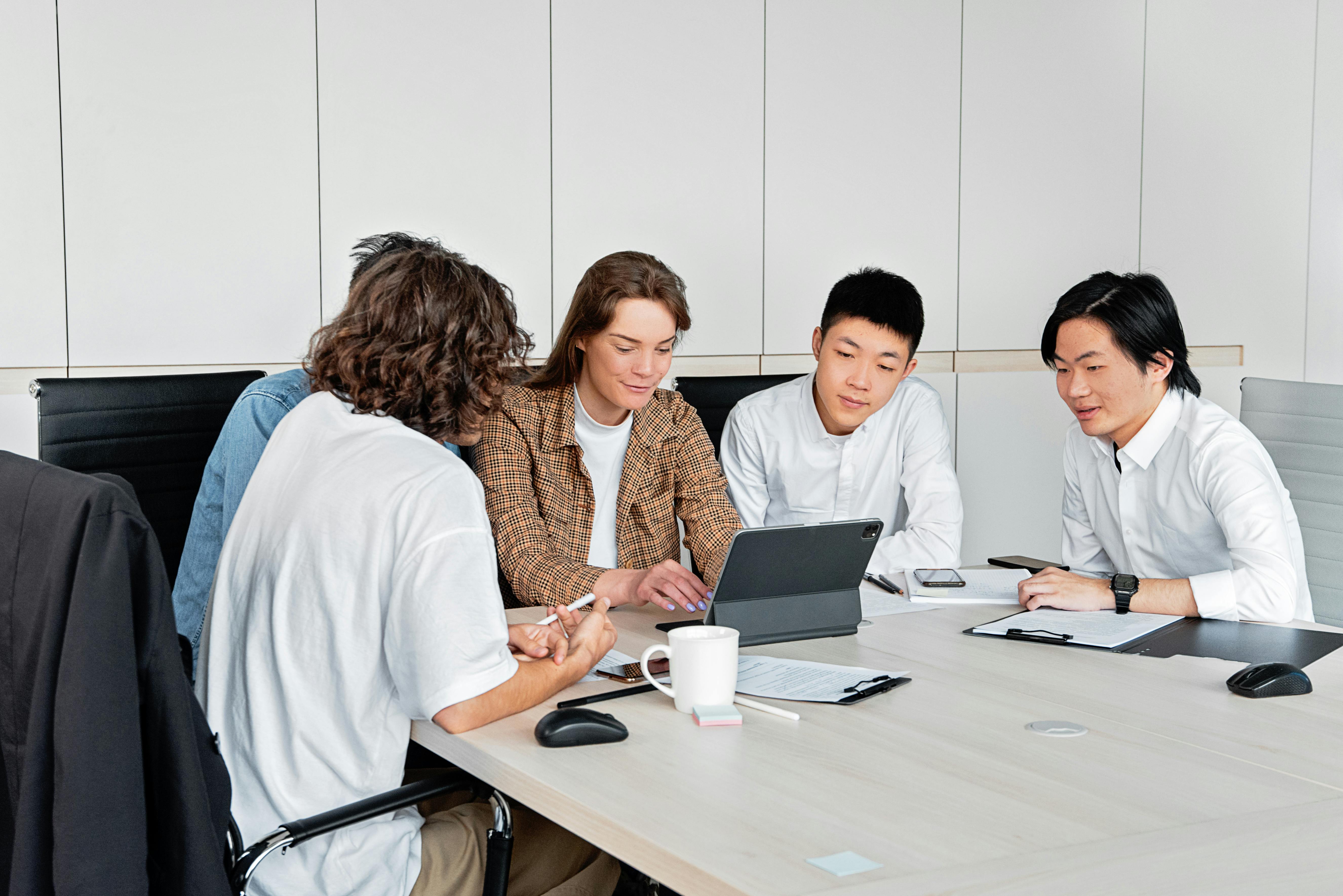 Young Chinese interns conducting professional teamwork at US foreign‑funded enterprise via ITP program