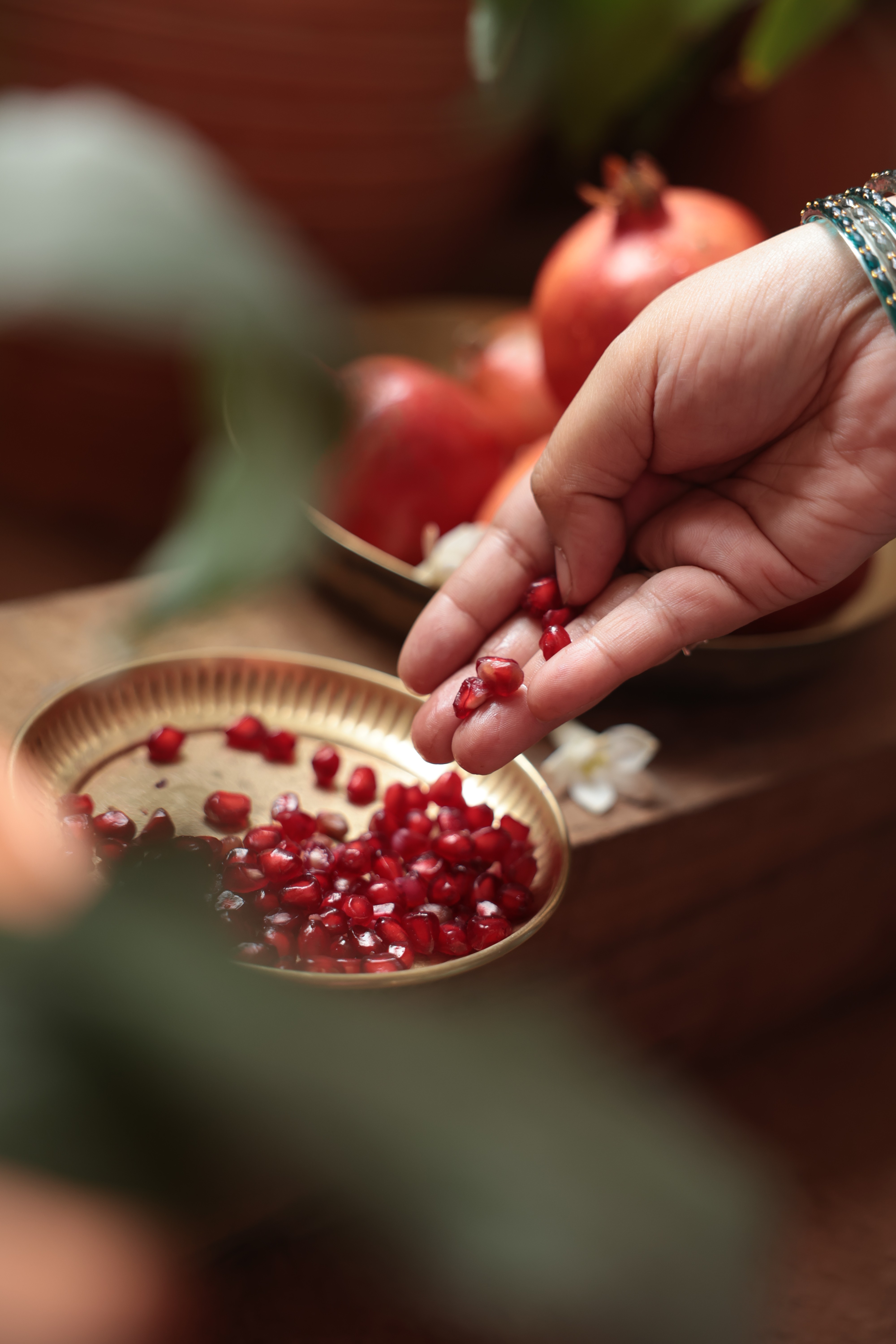 Woman potting a plant on a porch