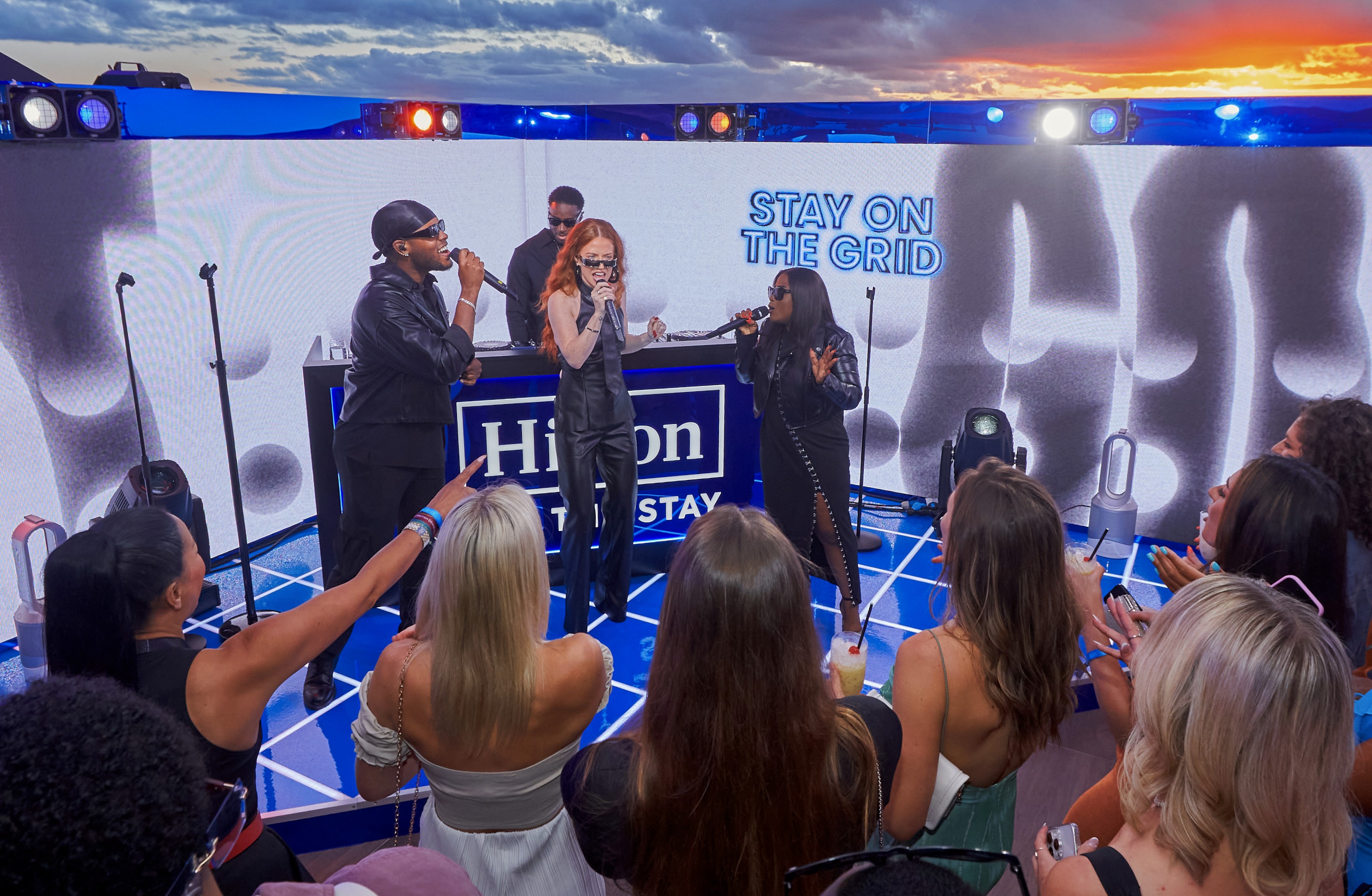Event Photographer captures Singer Jess Lynne with guests dancing at Hilton for the stay party at British Grand Prix Silverstone.