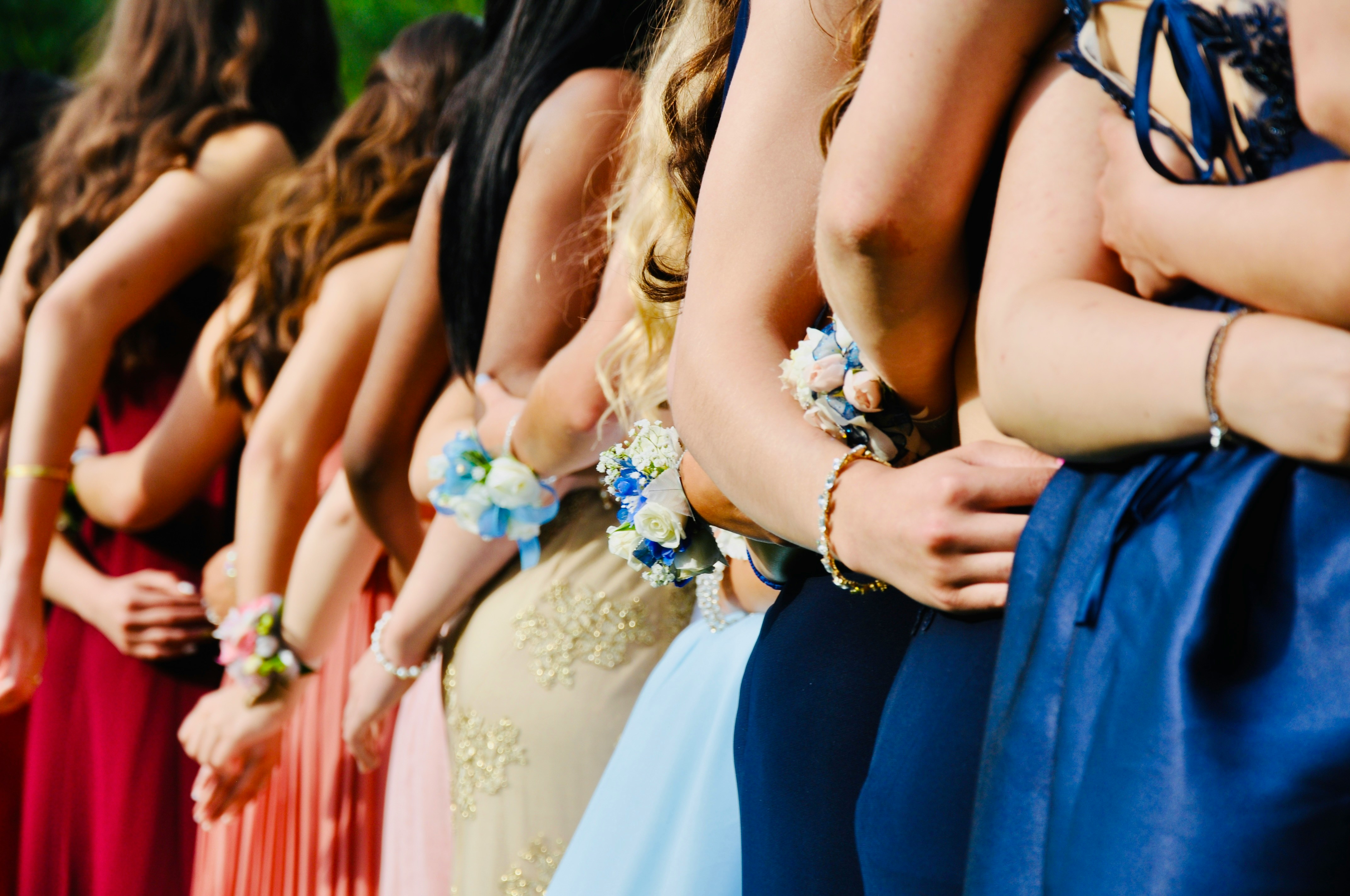 girls standing in a line - What Color Prom Dress Should I Wear