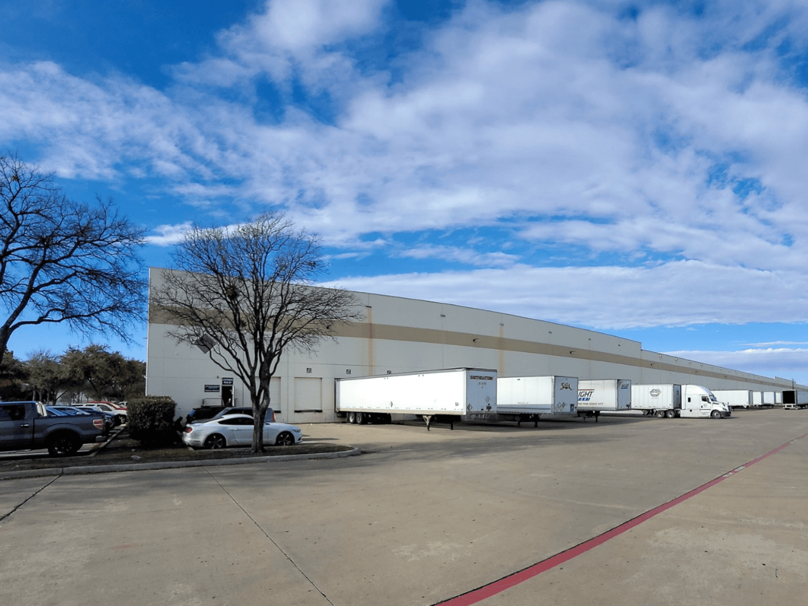 Prism Logistics warehouse team group photo