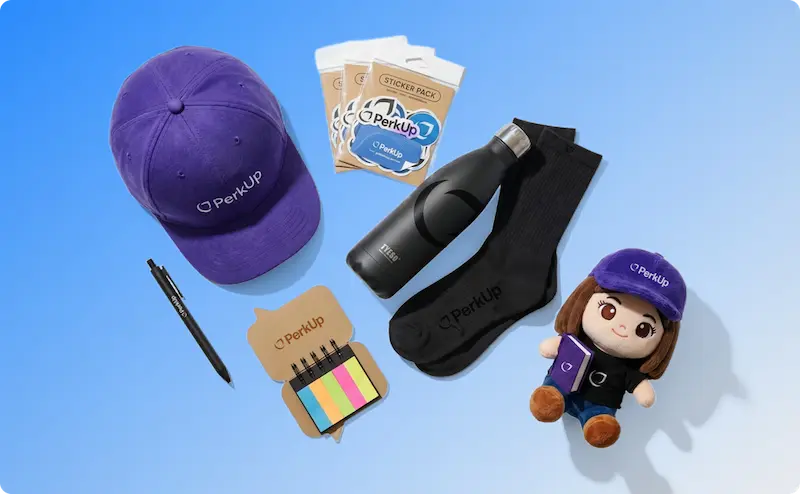 Various swag items including a cap, a sticker pack, a tumbler, a pair of socks, a pen, sticky notes, and a plushie.