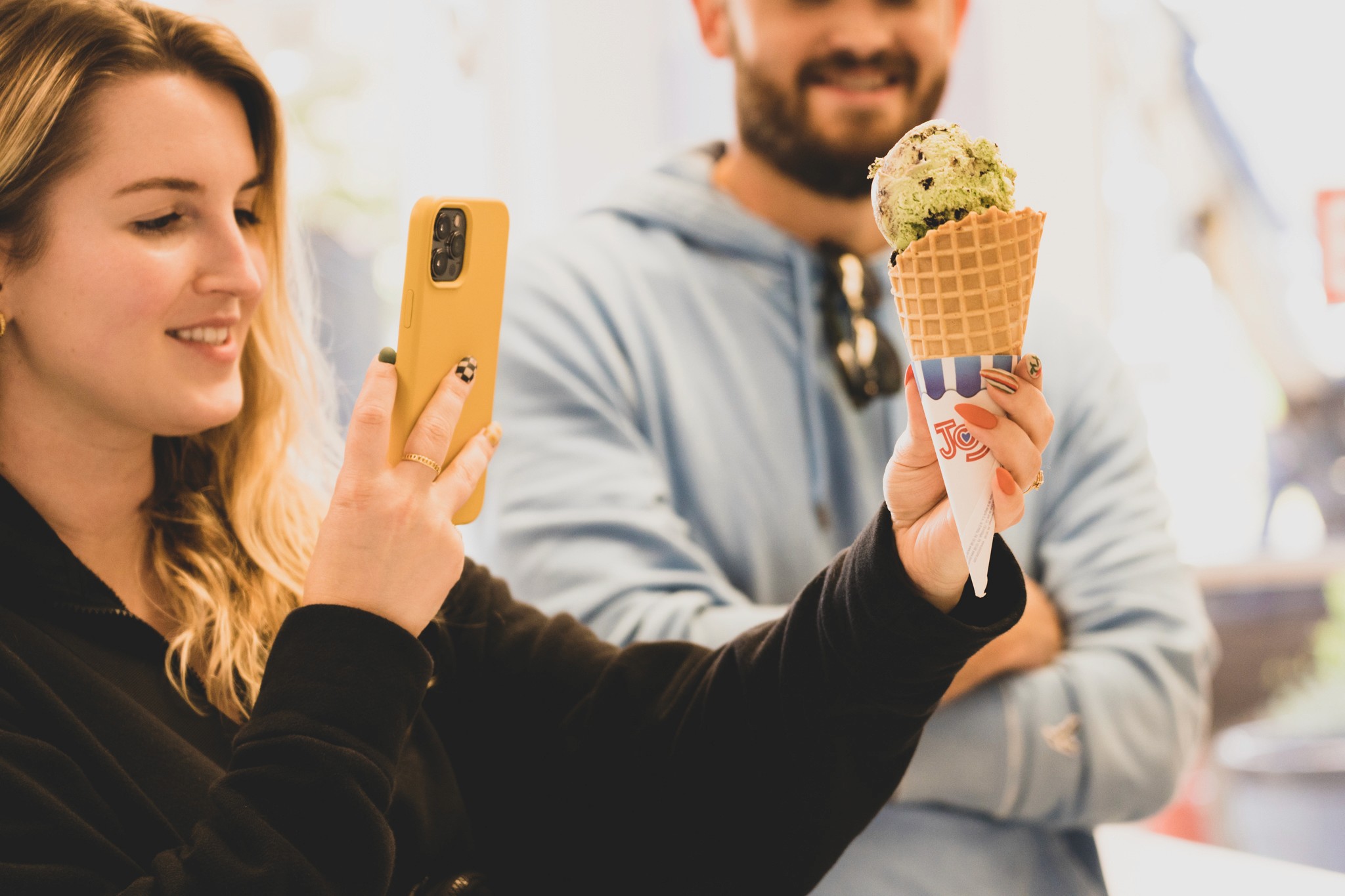A close up of an iPhone on a white surface