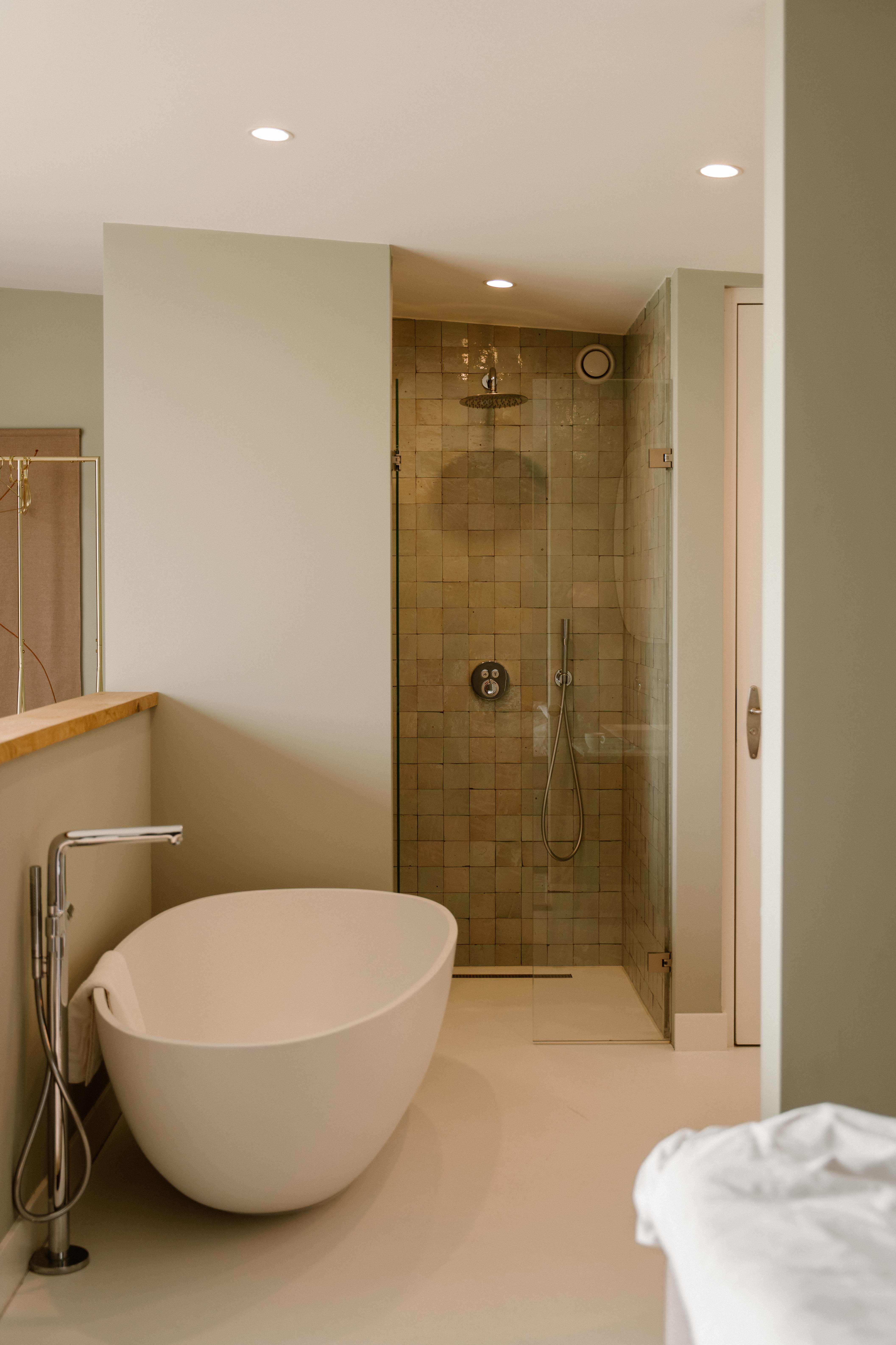 mountain valley with green grass and little village in the middle