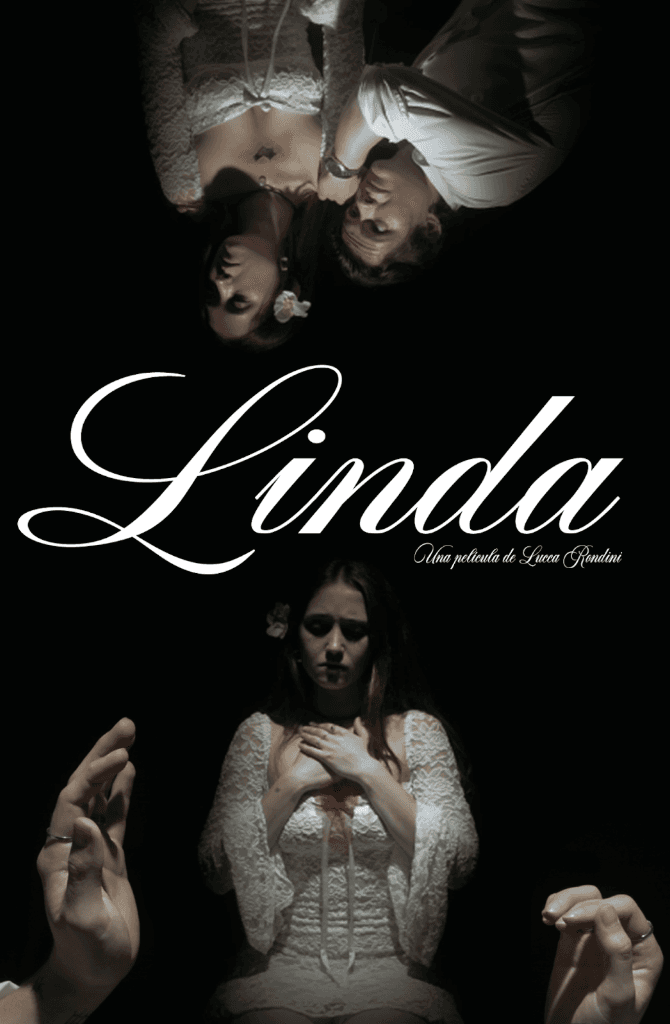 Woman in a light suit sitting thoughtfully against a terracotta wall