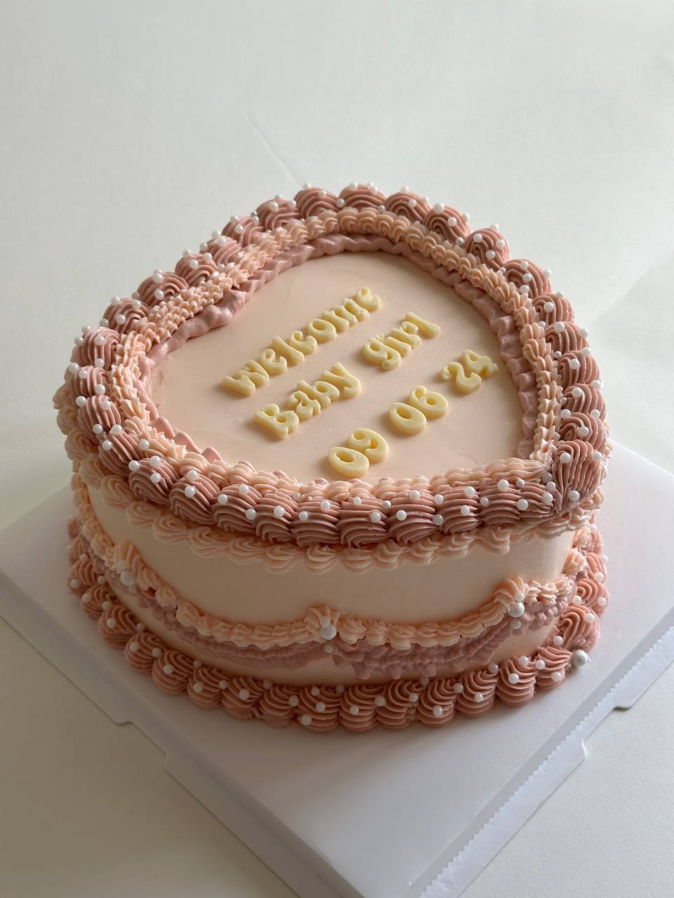 Birth cake, pastel peach coloured