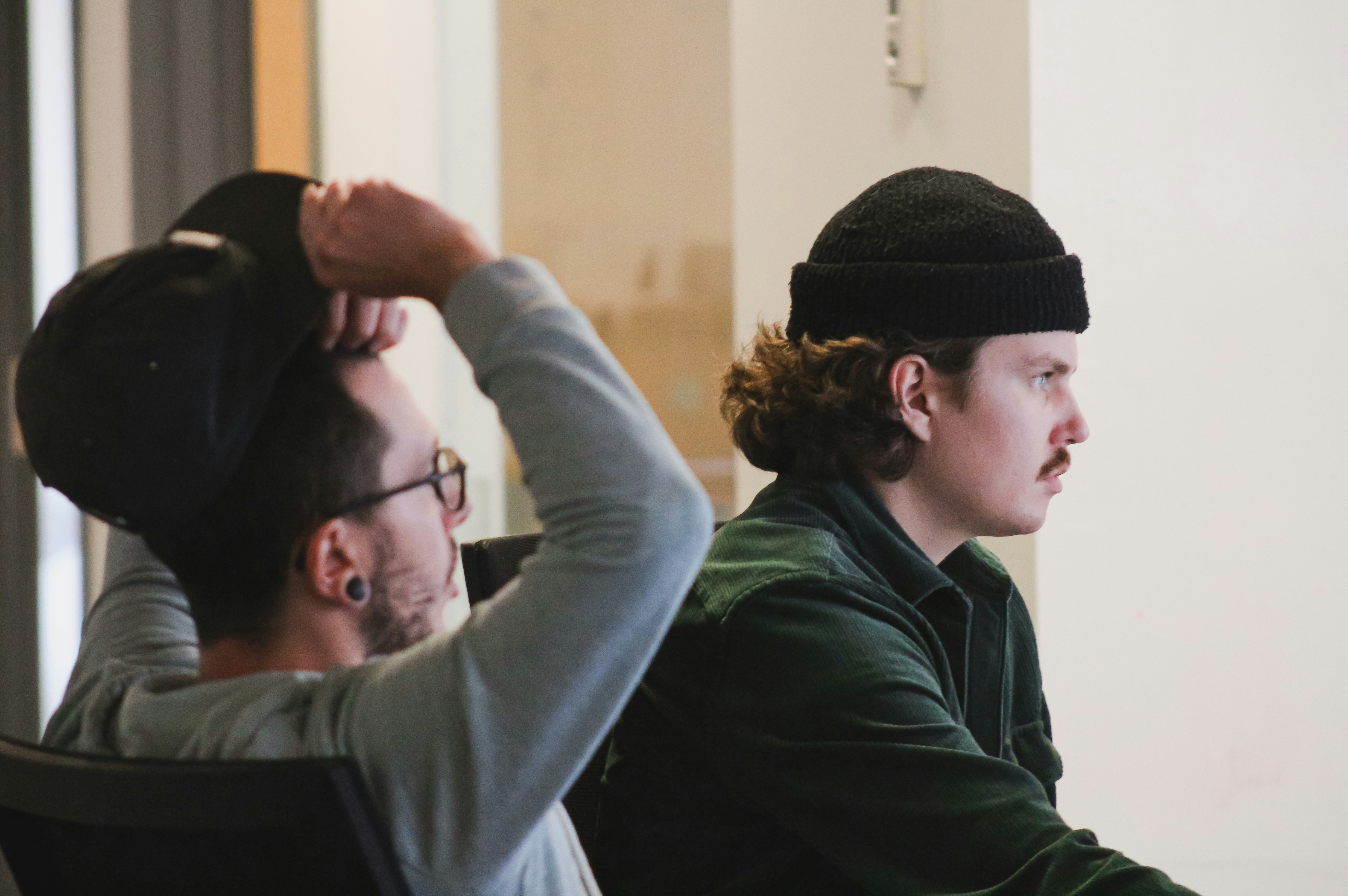 Two people are sitting in the office, discussing the upcoming project.