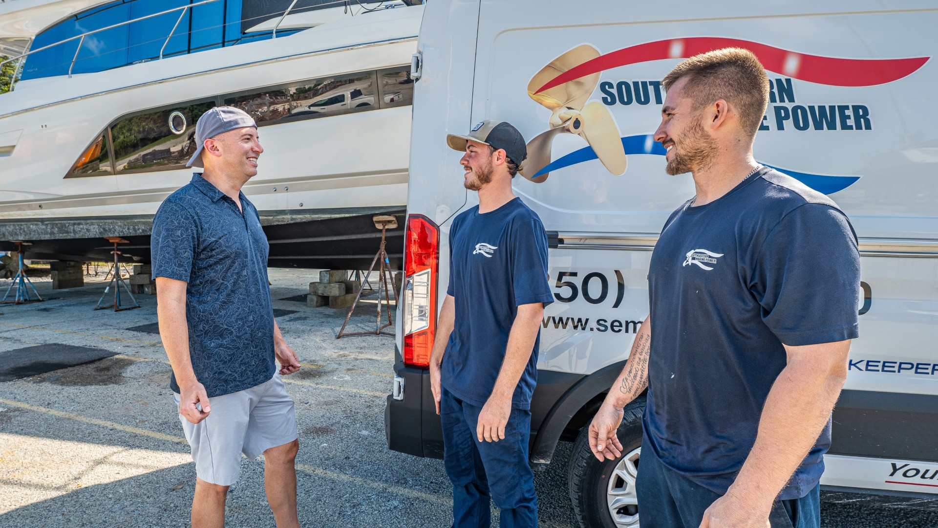 Chris McPherson, Southeastern Marine owner, with Southeastern Marine technicians