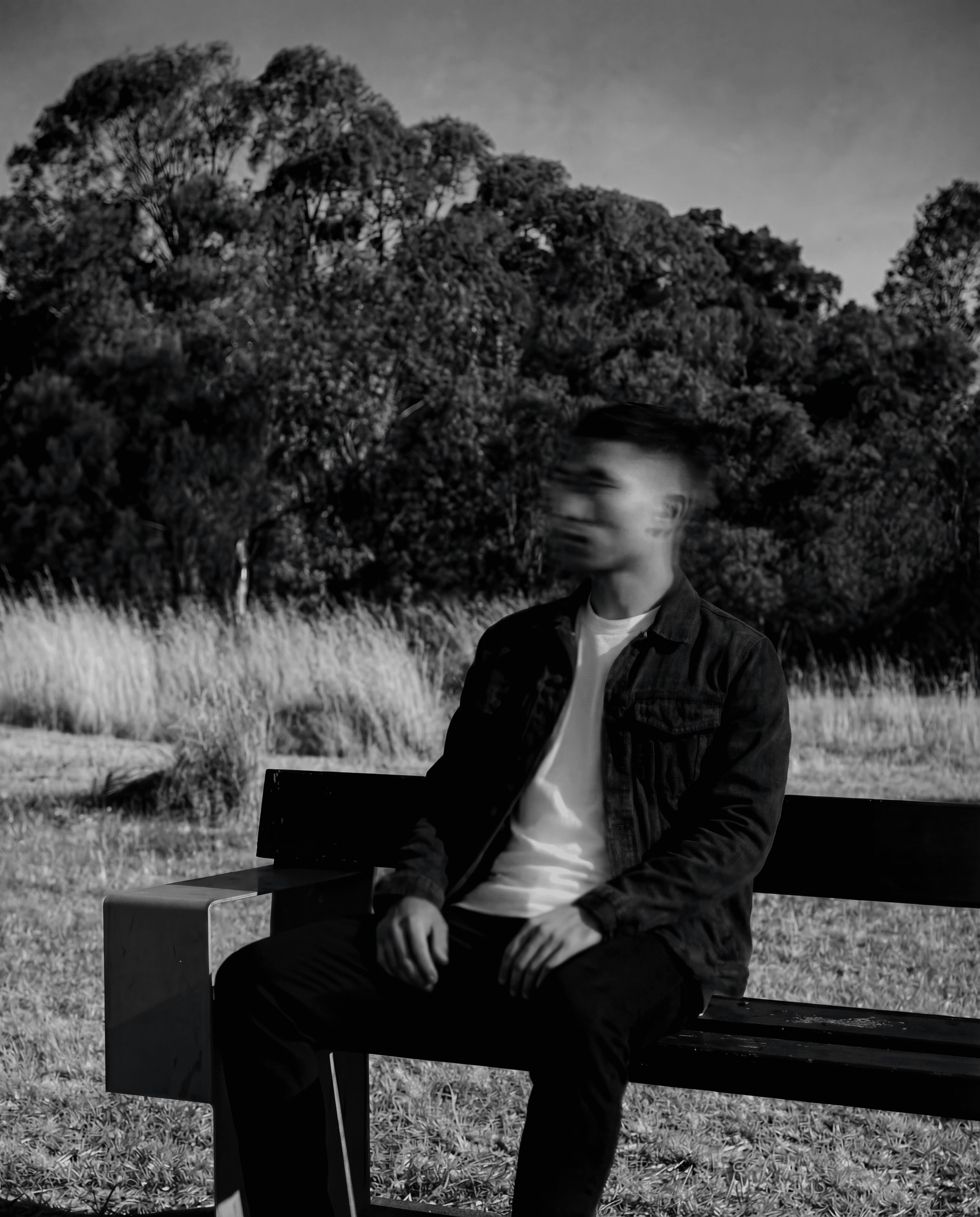 a blurry photo of a person standing in front of a wall