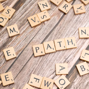 scrabble tiles spelling out words on a wooden surface