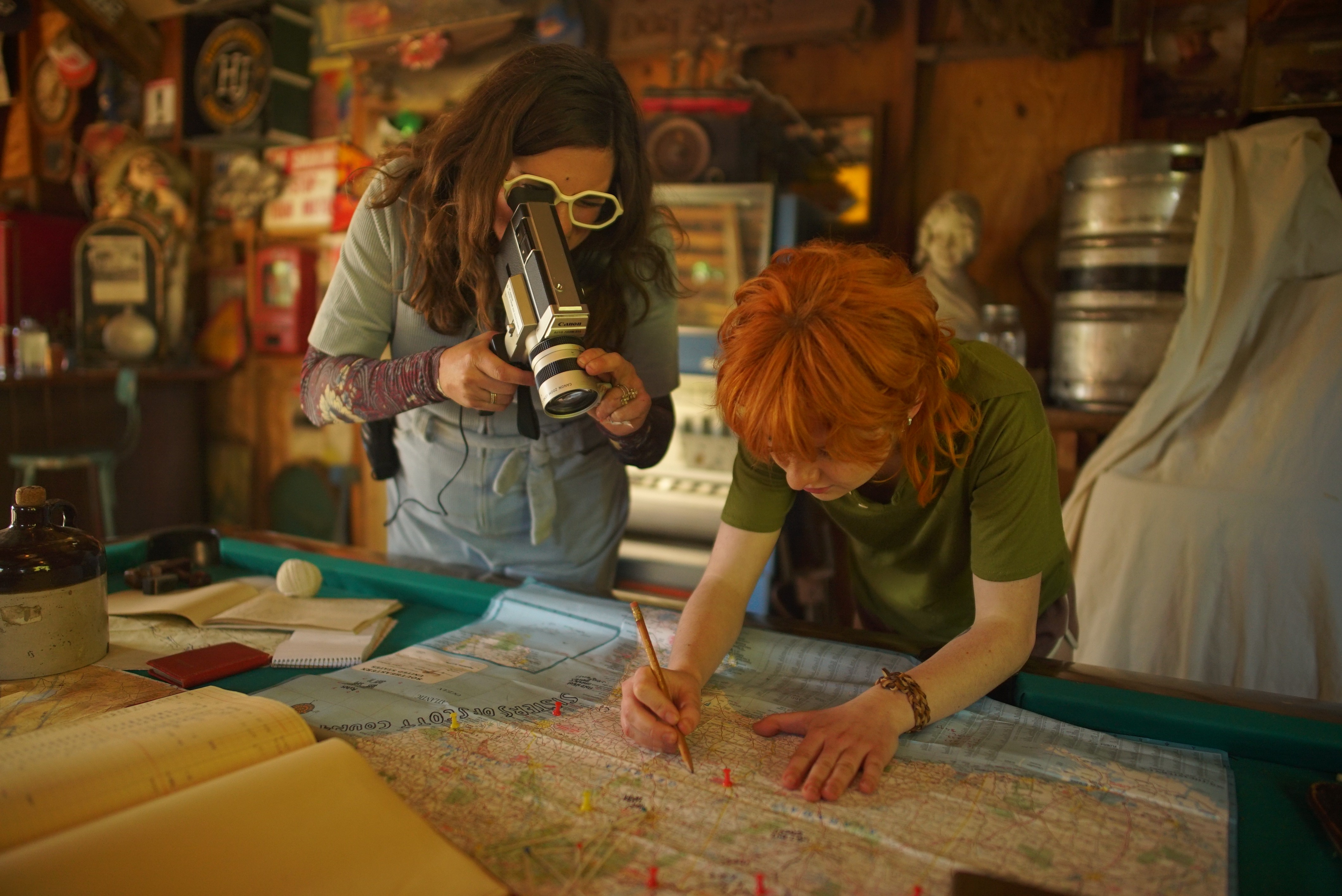 a woman standing in front of a camera