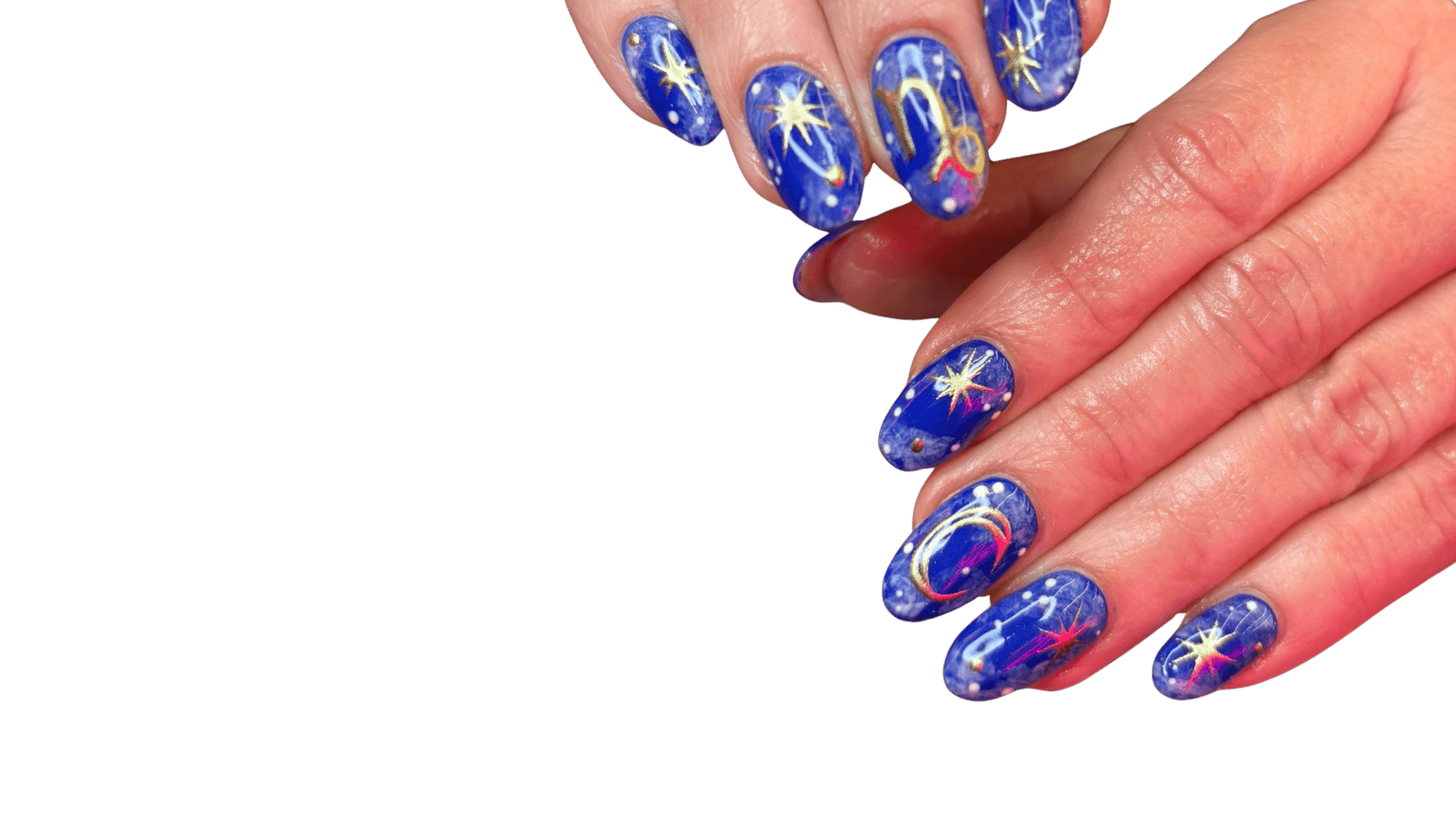 Close-up of almond-shaped nails featuring a deep blue galaxy base, hand-painted gold stars, and a golden Capricorn zodiac symbol.