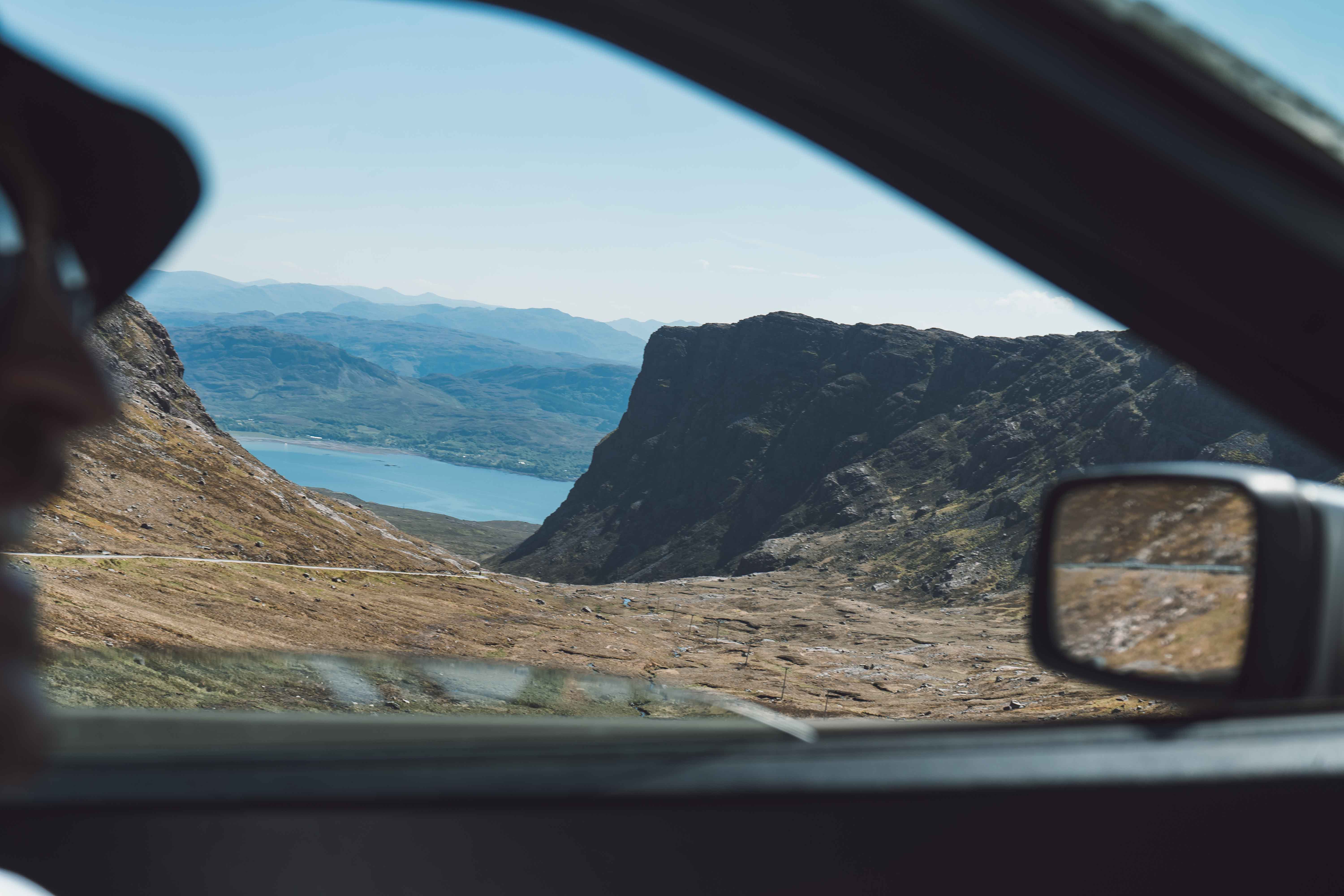 Majestic sandstone formations in AlUla glowing under the afternoon sun, showcasing the desert’s timeless beauty.